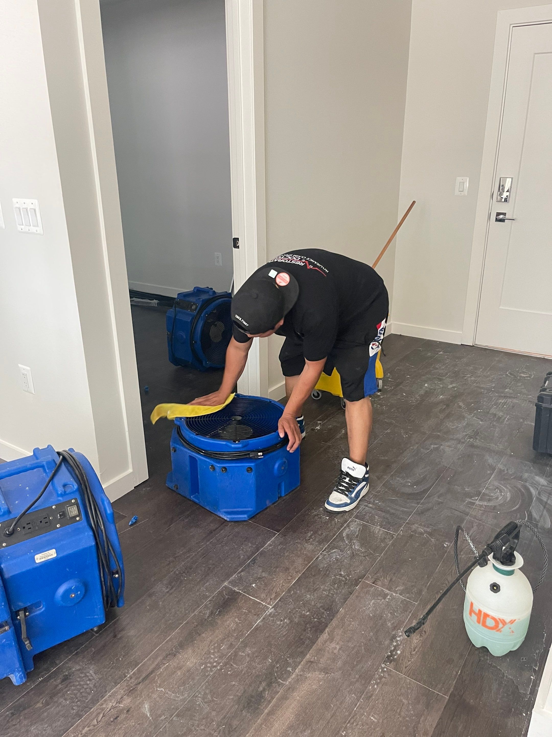 Continued dehumidification process with equipment monitoring structural drying progress in the restoration.