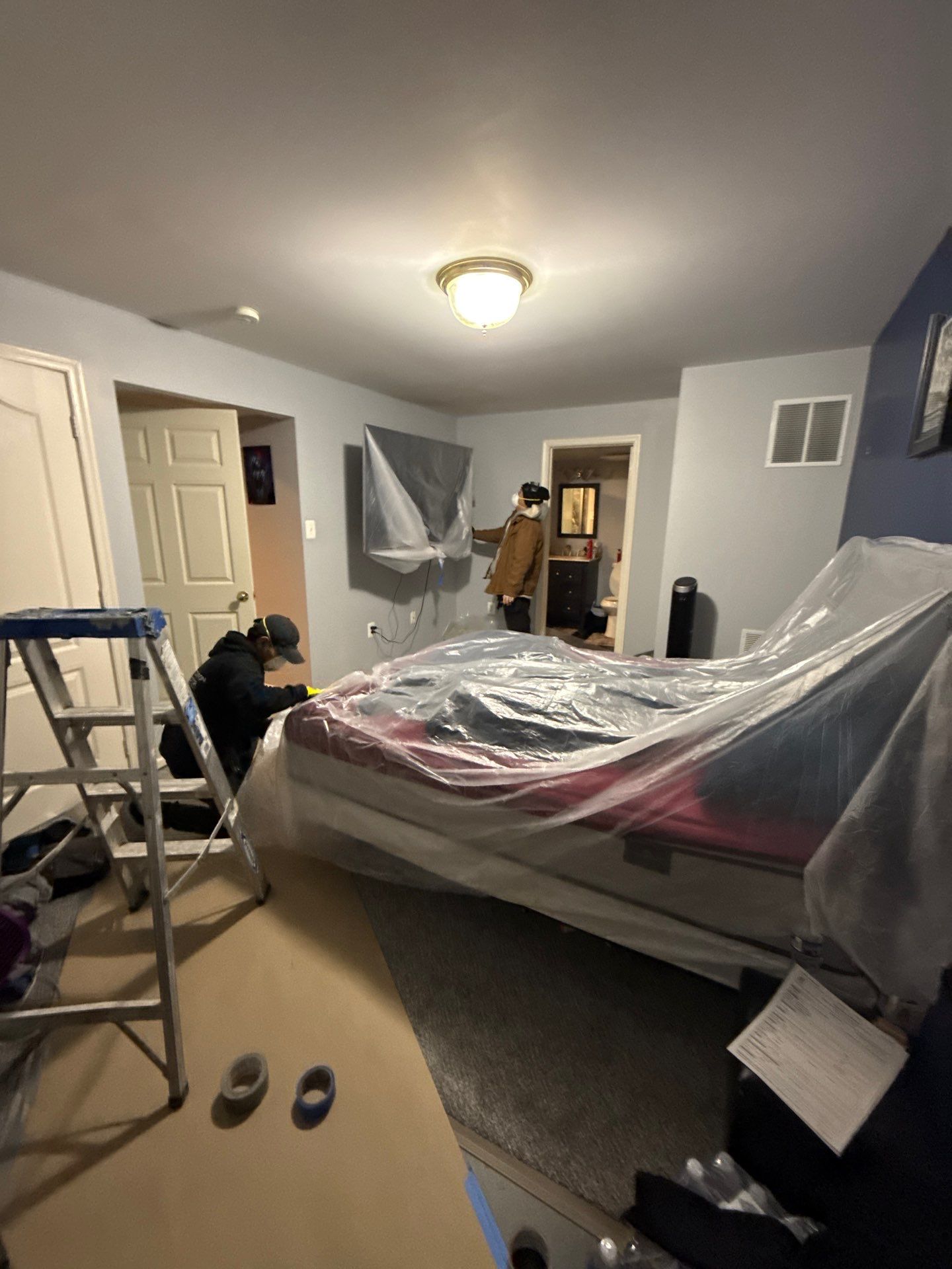 Wet drywall and framing exposed during damage assessment and drying phase.