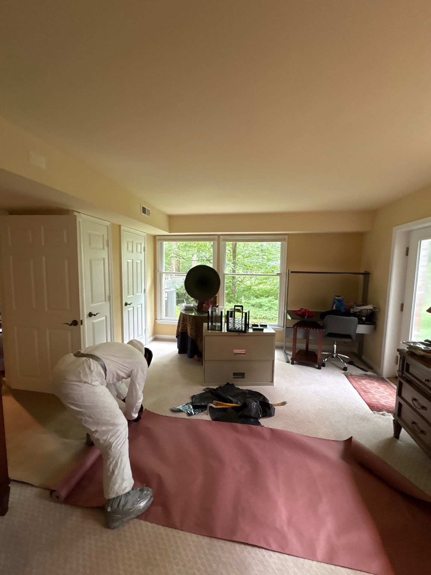 Mid-stage mold remediation in McLean showing treated surfaces and continued moisture extraction and sanitizing efforts.
