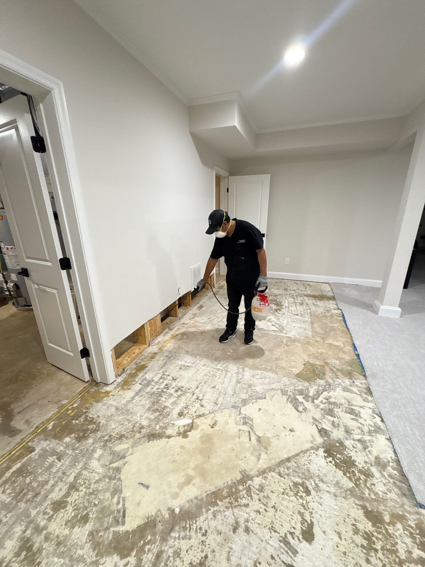 Oakton water damage restoration complete: new flooring and baseboards installed, structural integrity restored.
