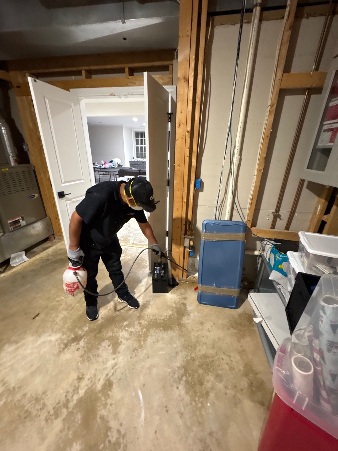 Flooring remediation underway as drying progresses and damaged carpet is prepared for replacement.