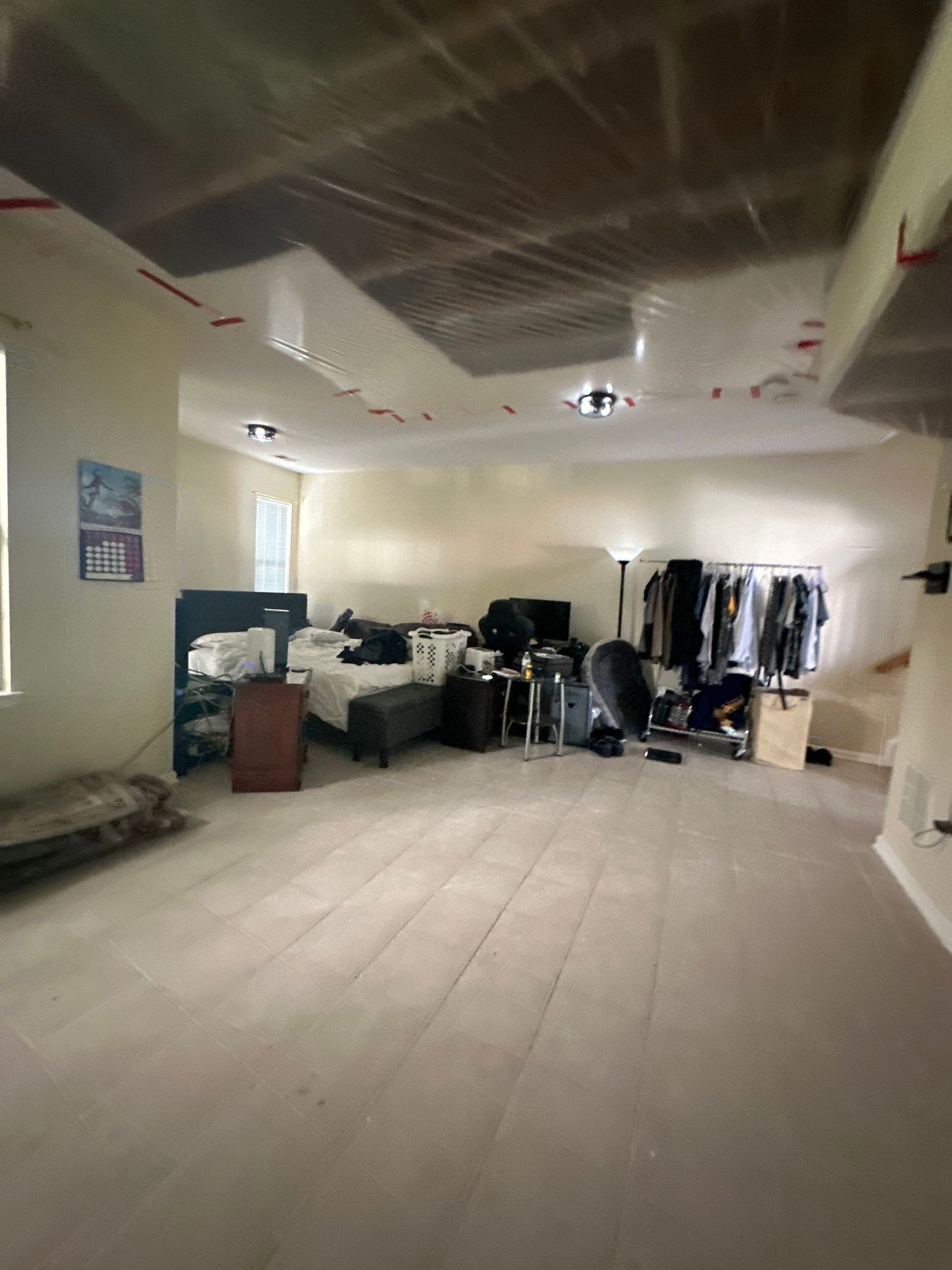 Structural drying in progress with dehumidification equipment positioned to manage moisture in ceiling cavity.