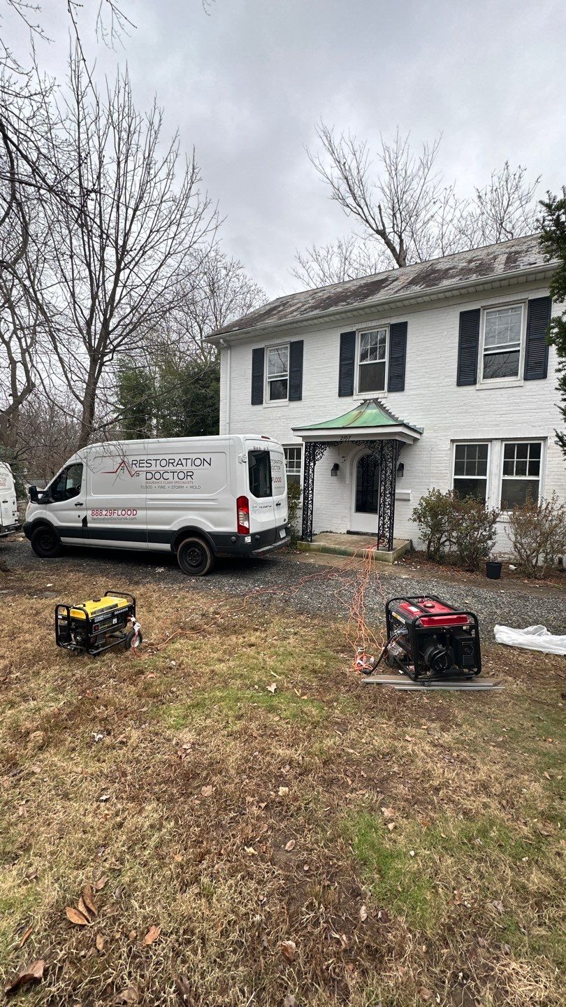 Water damage restoration in McLean with dehumidification equipment positioned for structural drying.