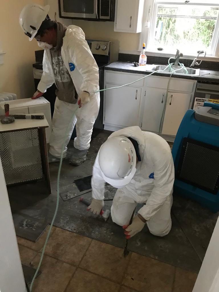 Final inspection of water damage restoration in McLean after dehumidification and structural drying completion.