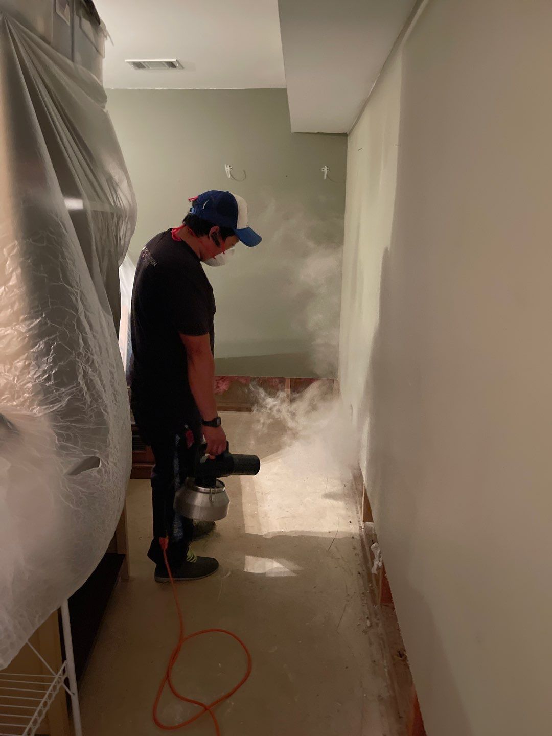 Dehumidification equipment positioned for structural drying during restoration process.