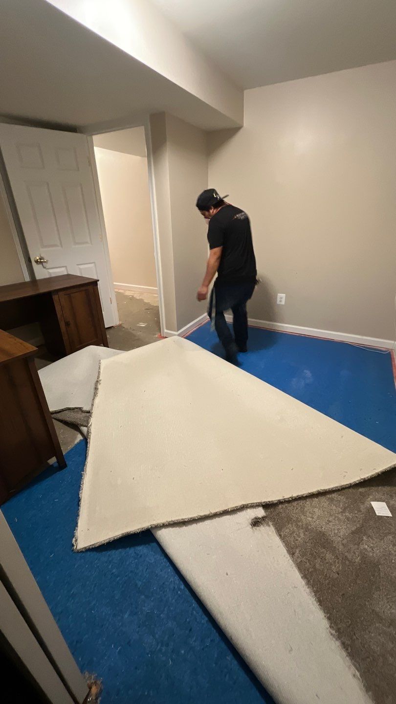 Water extraction and dehumidification setup in Leesburg home, initial damage assessment phase.