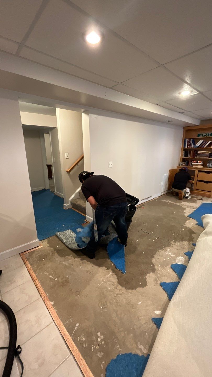Continued dehumidification and drying of structural materials before carpet and flooring replacement.