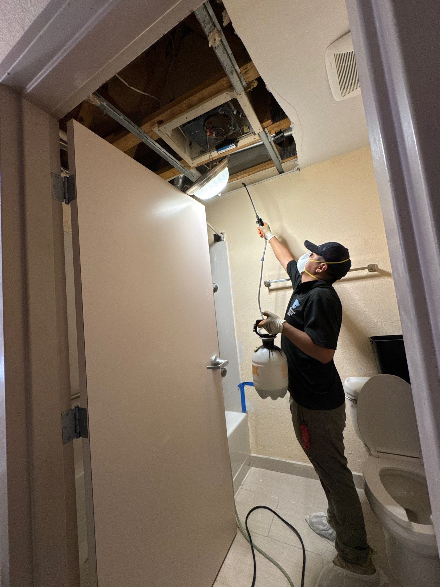 Ceiling damage assessment and preparation for repair during Manassas water damage restoration sequence.