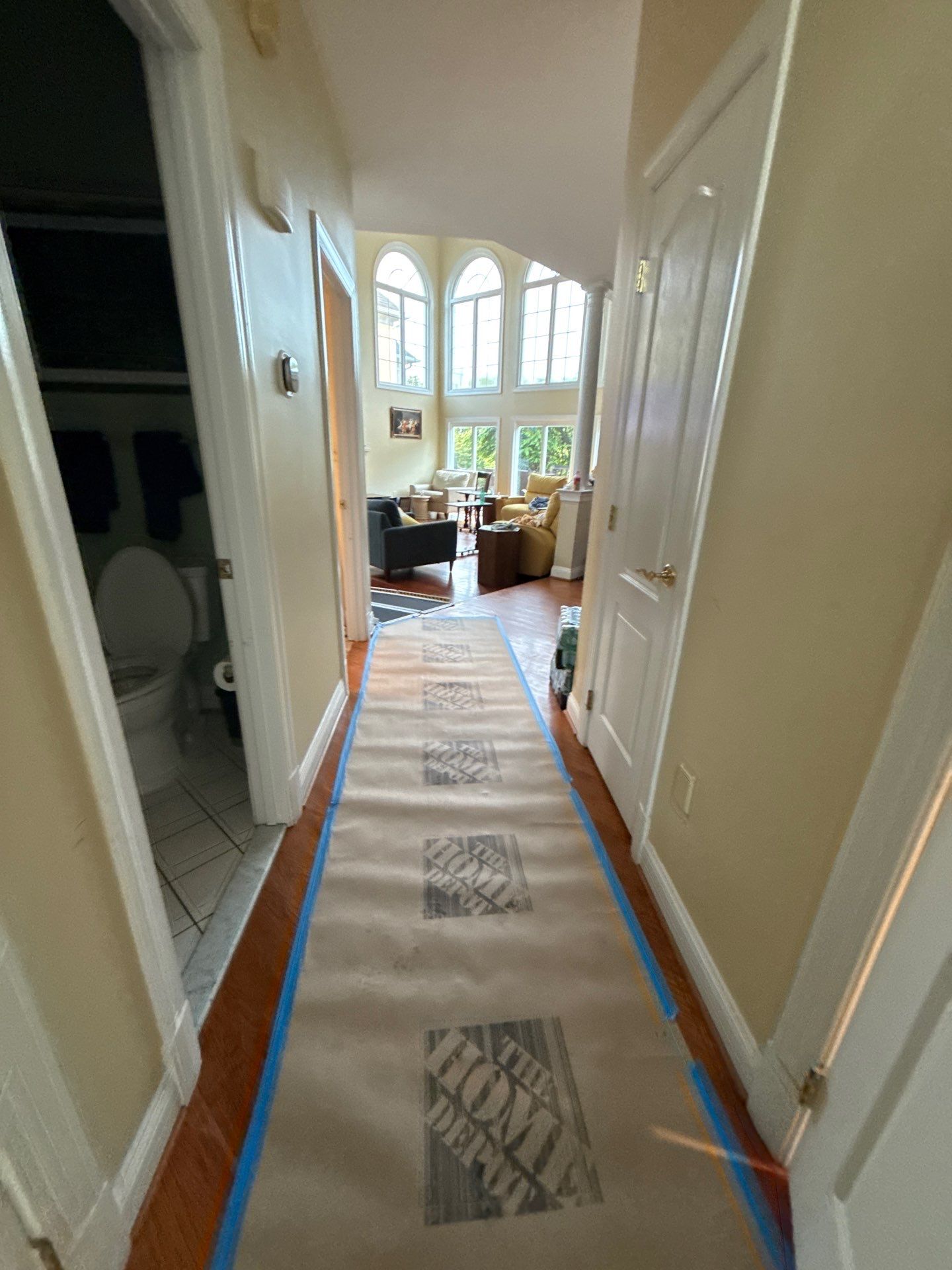Carpet removal and remediation of water-damaged flooring materials during mid-stage restoration.