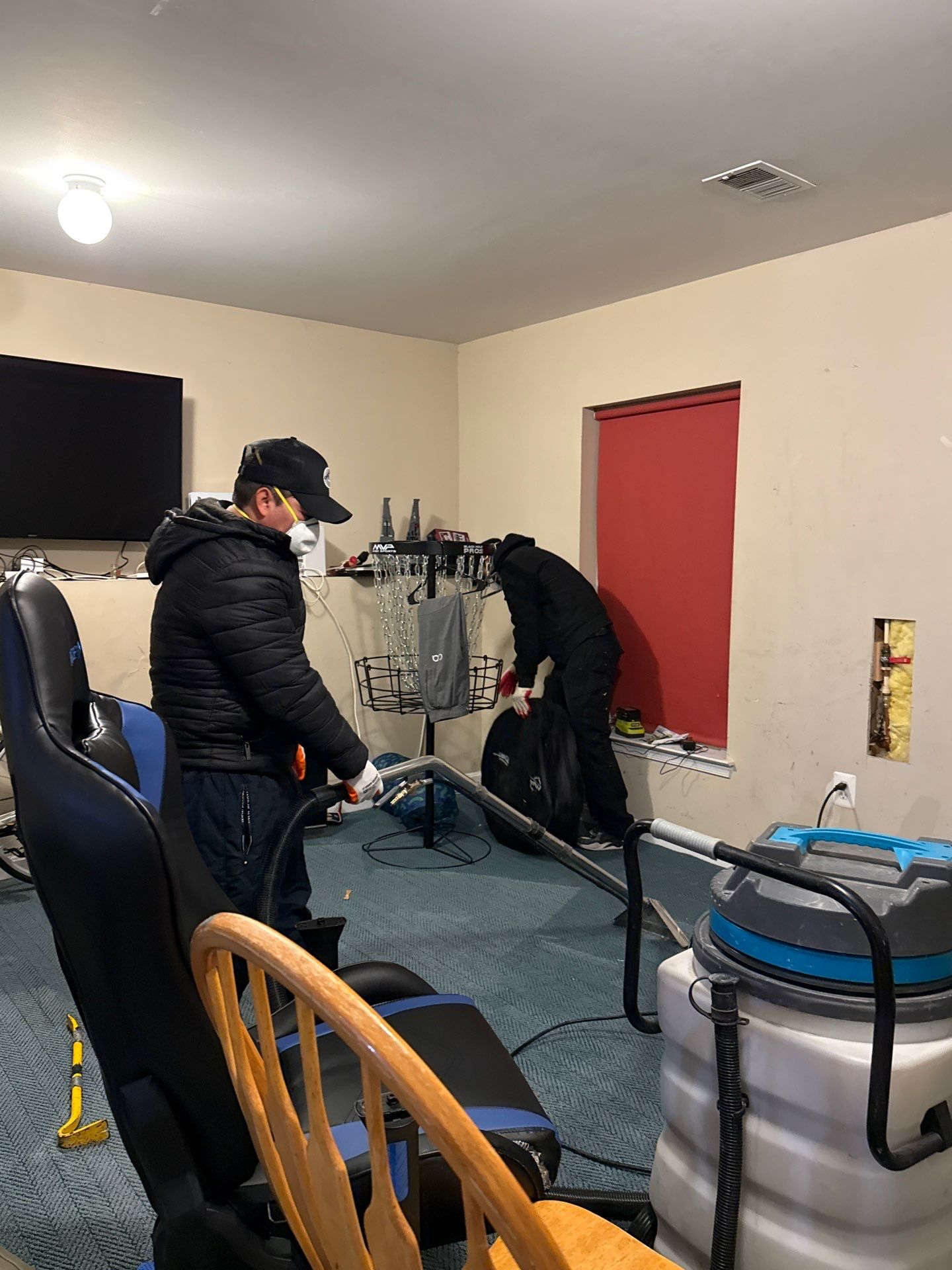 Dehumidifiers and air movers positioned for drying phase.