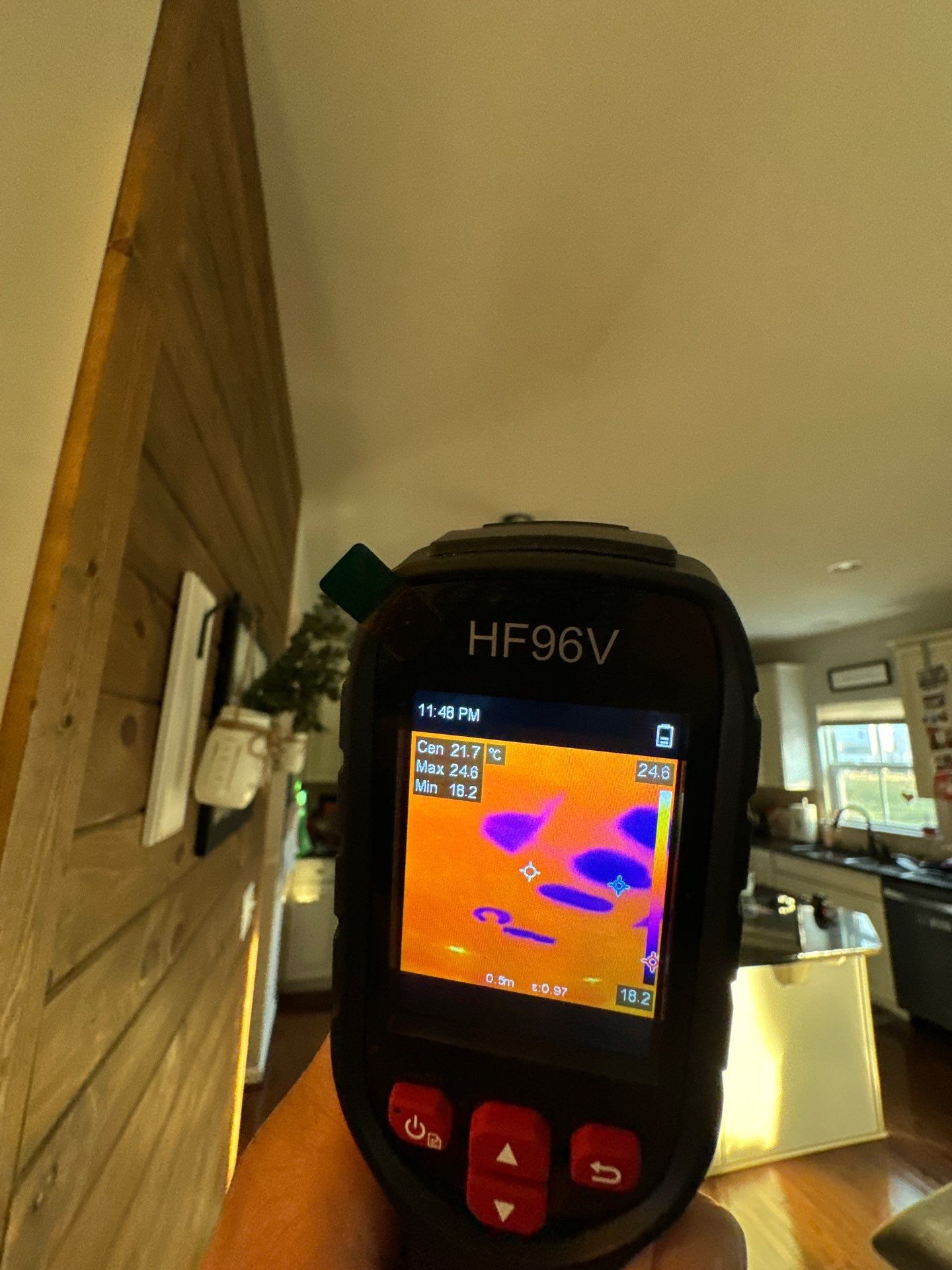Moisture inspection underway, thermal data guiding identification of hidden water damage in ceiling cavity.