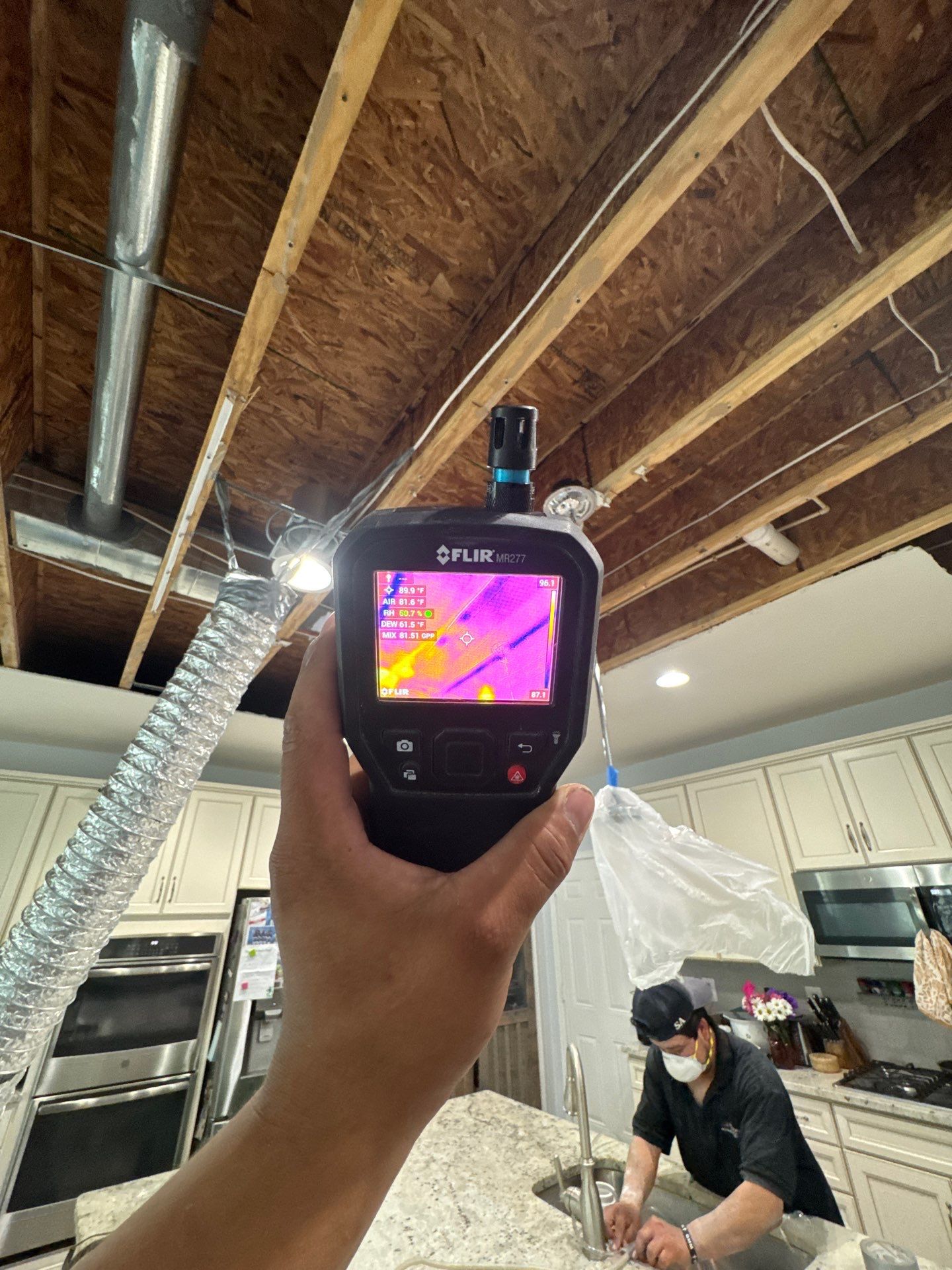 Structural drying equipment positioned to remove residual moisture from framing and materials.