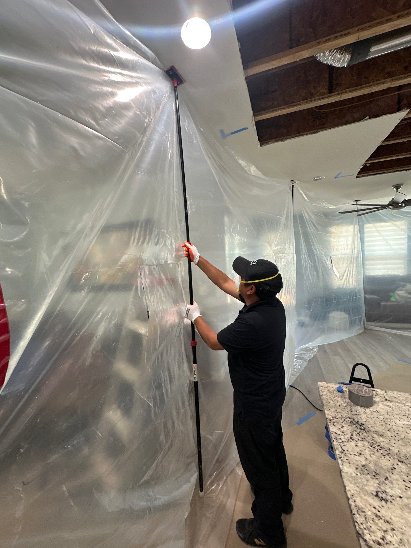 Thermal imaging inspection mapping moisture distribution within contained work zone during remediation.