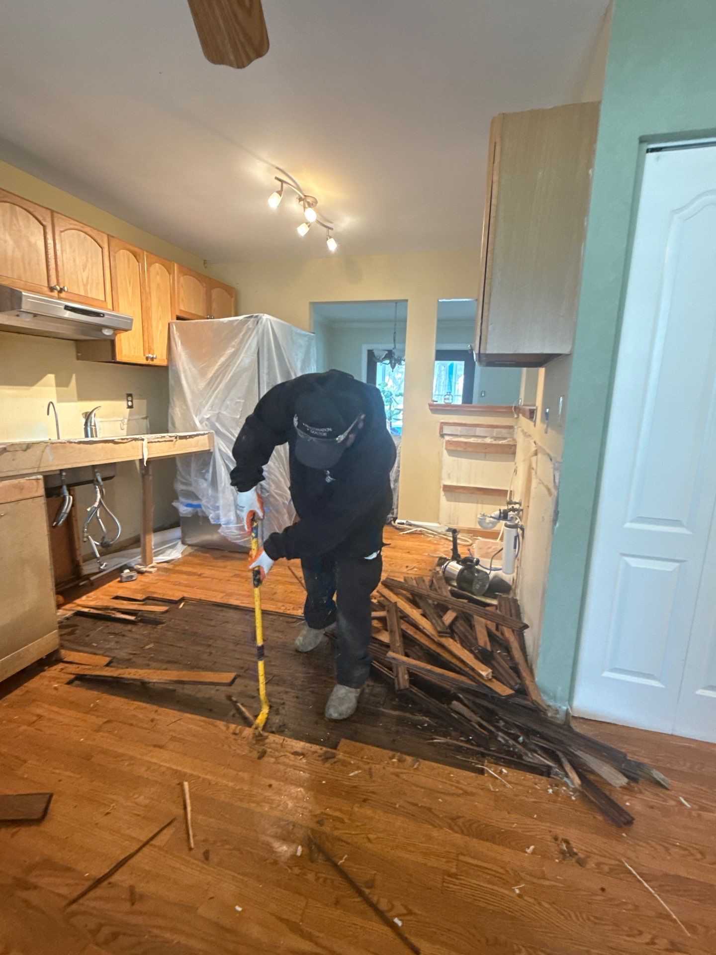 Air movers and structural drying setup in progress, monitoring moisture removal during water damage restoration.