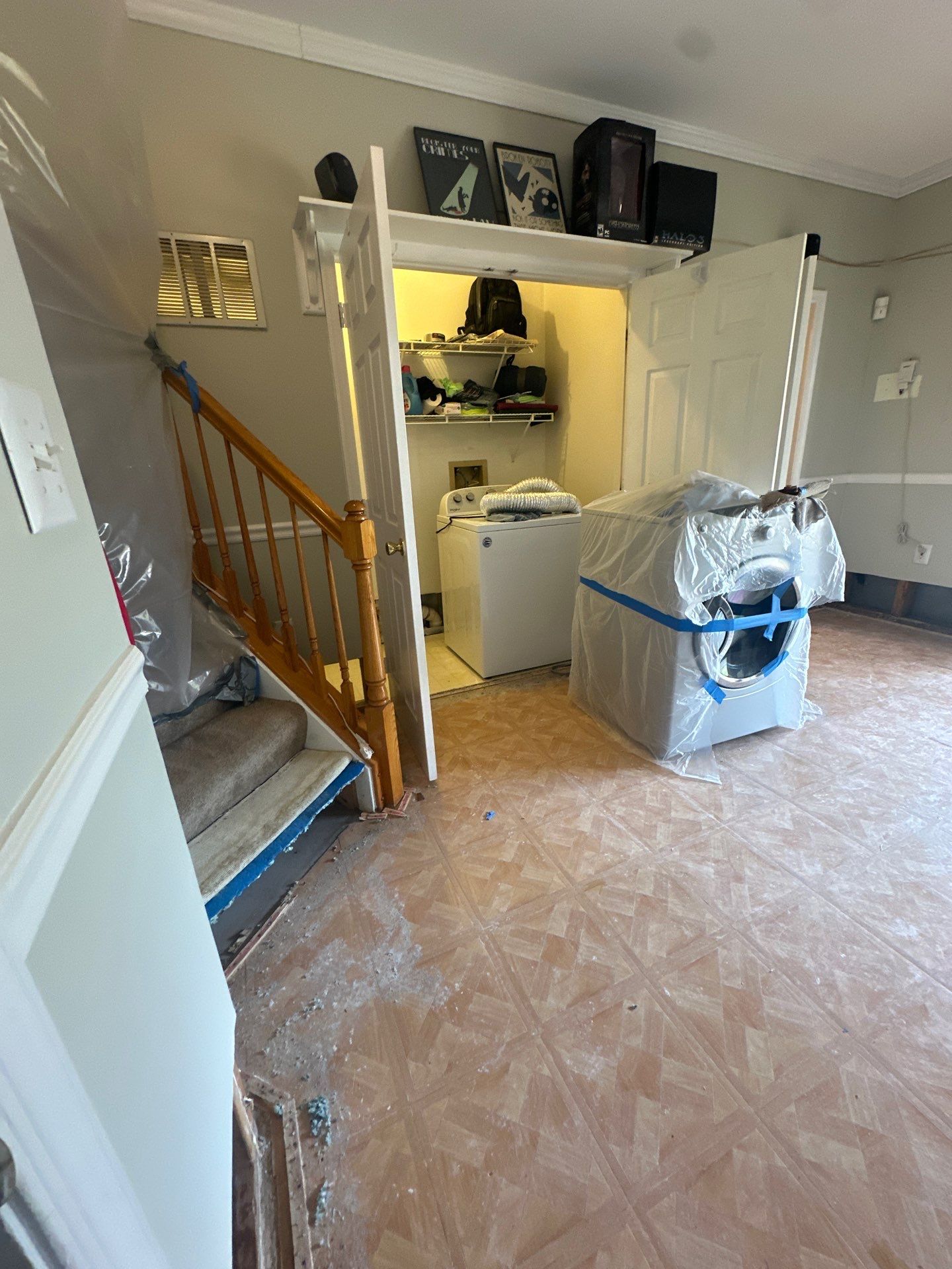 Water-damaged wall framing and flooring exposed during initial assessment in Centreville water restoration.