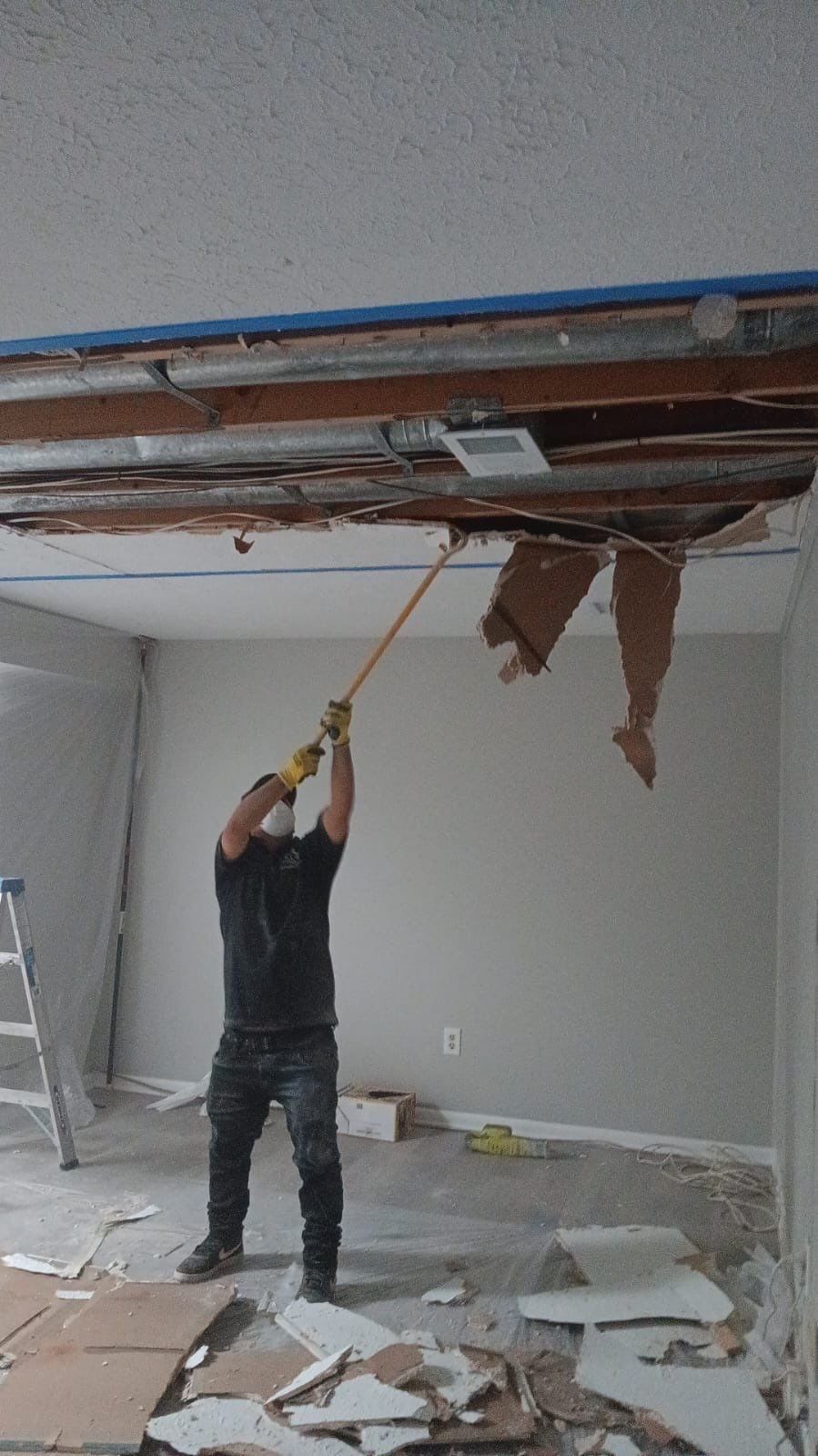 Dehumidifiers and air movers operating during active structural drying phase.
