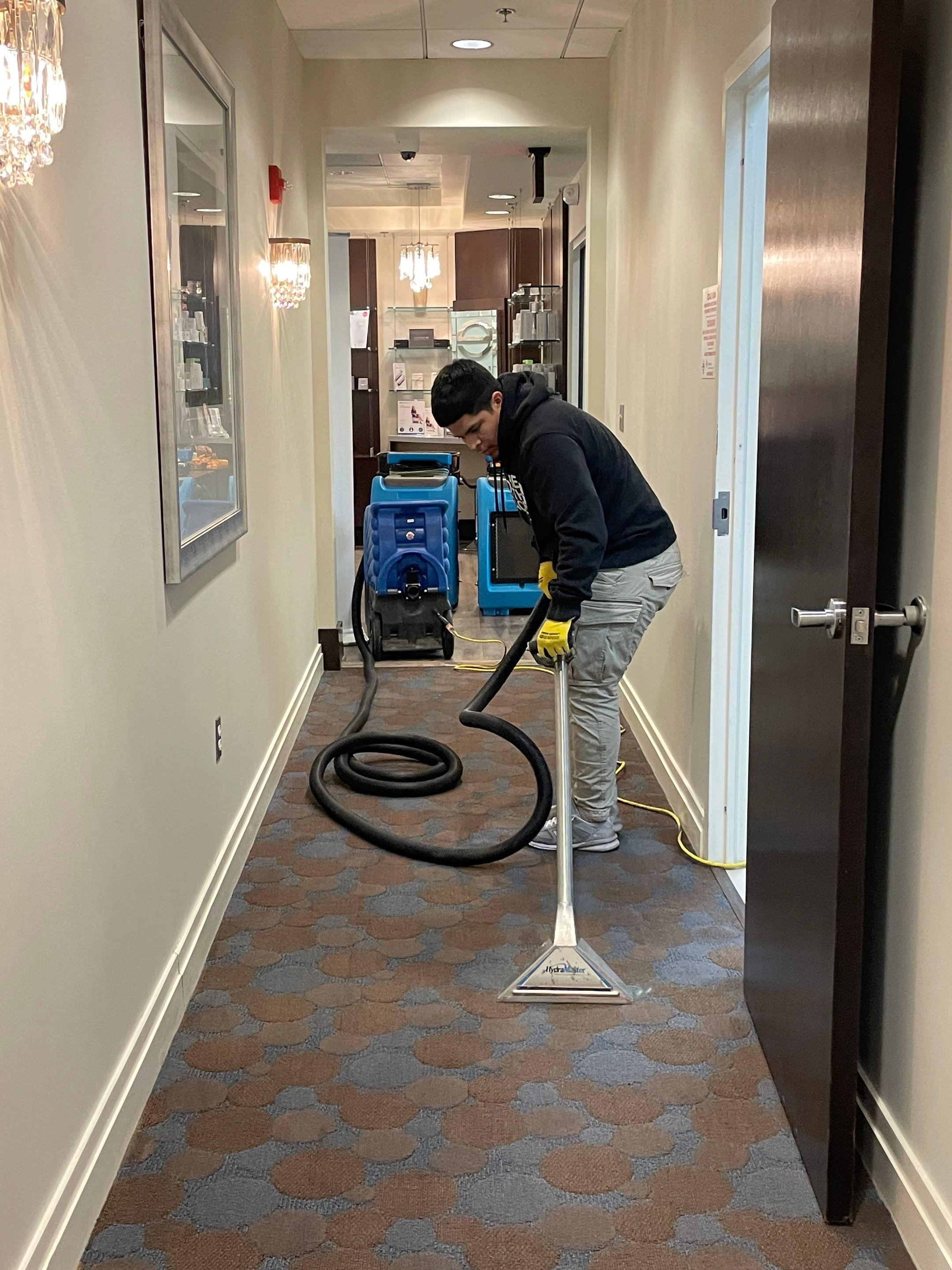Dehumidification equipment positioned to manage moisture levels throughout affected Leesburg home interior.