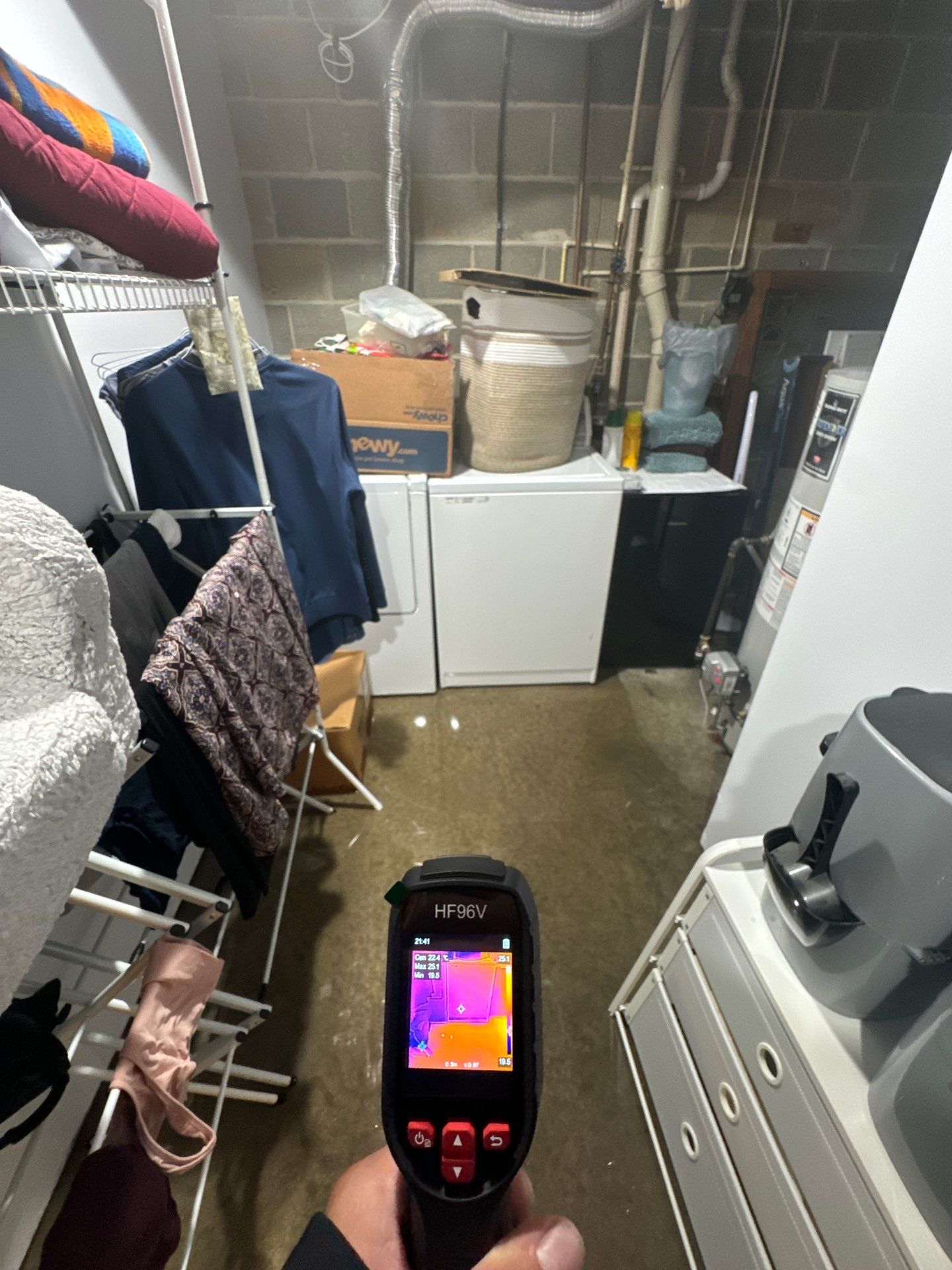 Standing water extraction underway within containment zone during water damage restoration.