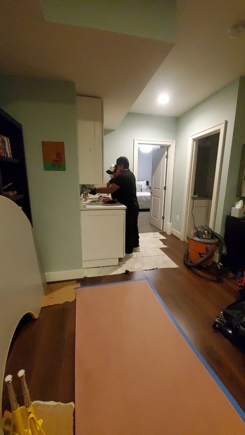 Final-stage water damage restoration in Alexandria with containment and drying equipment removal underway.