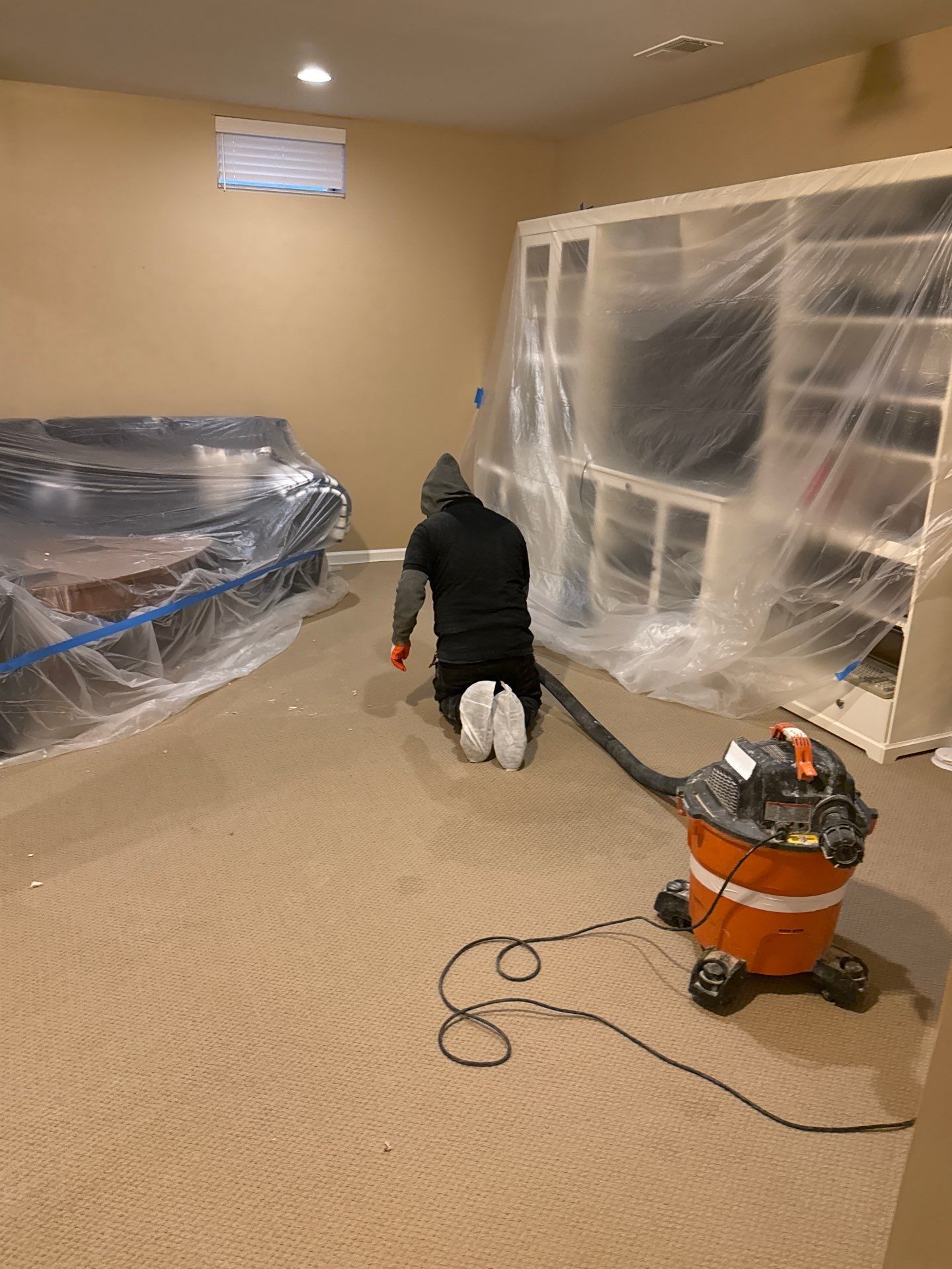 Containment barrier erected during mold remediation in Riding to isolate affected area before extraction and inspection.