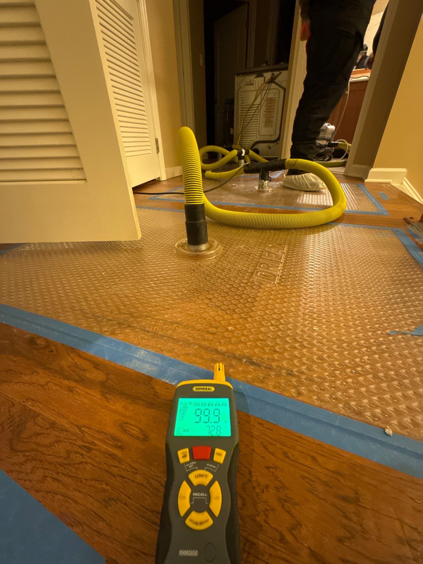 Standing water extraction underway within containment during Riding mold remediation work.