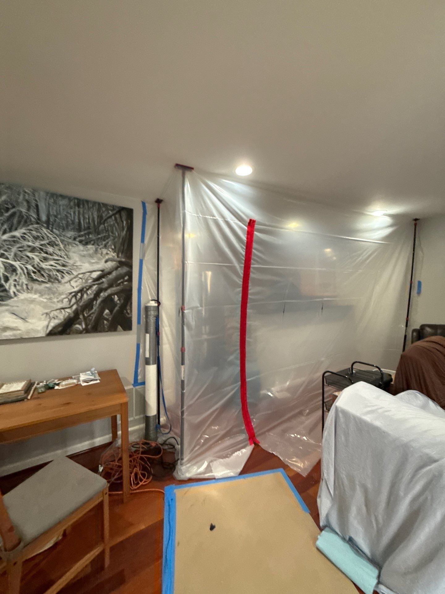 Continued structural drying with containment maintained to isolate affected zones in Arlington home.