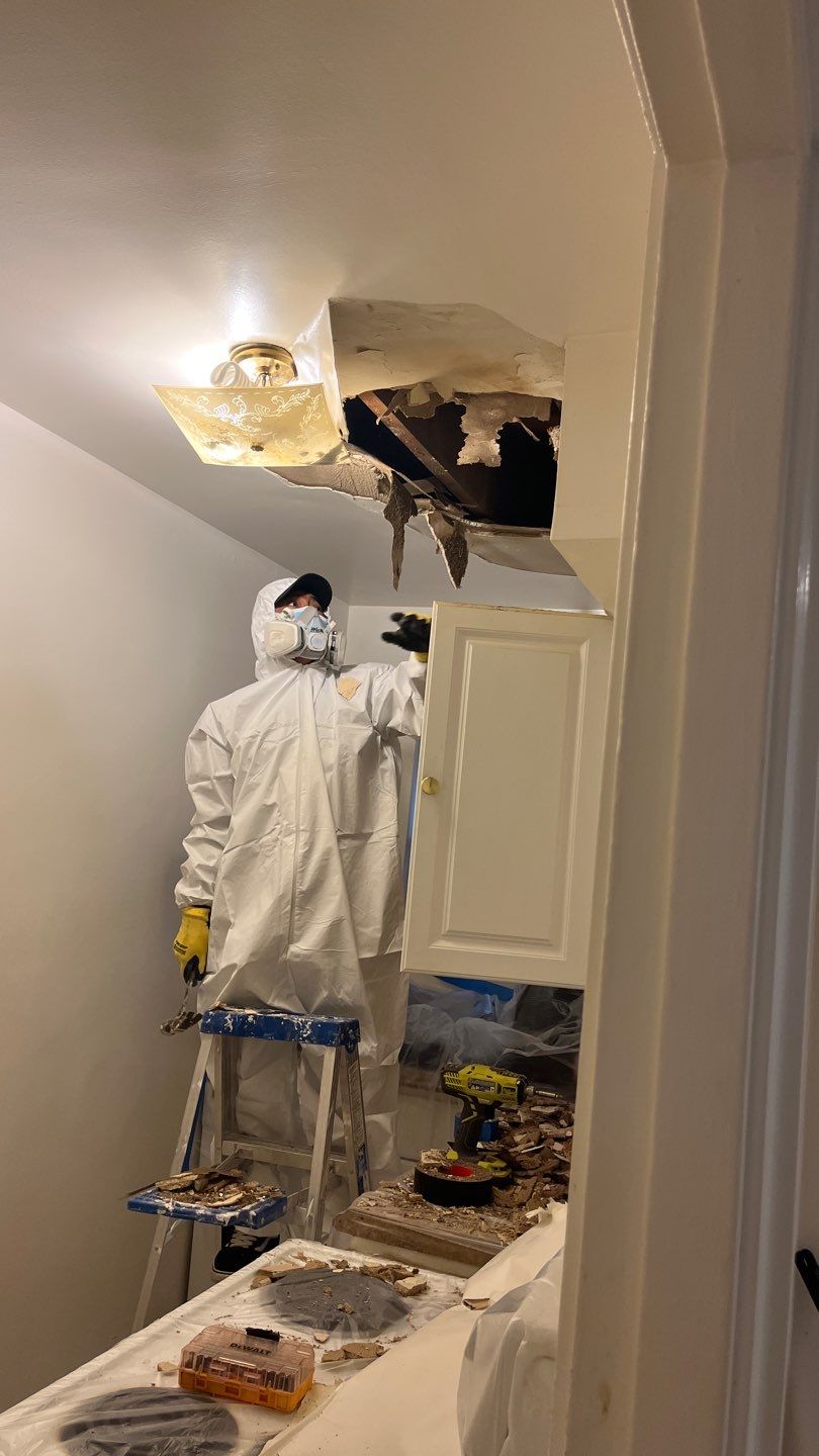 Structural drying equipment positioned throughout affected room during restoration work.