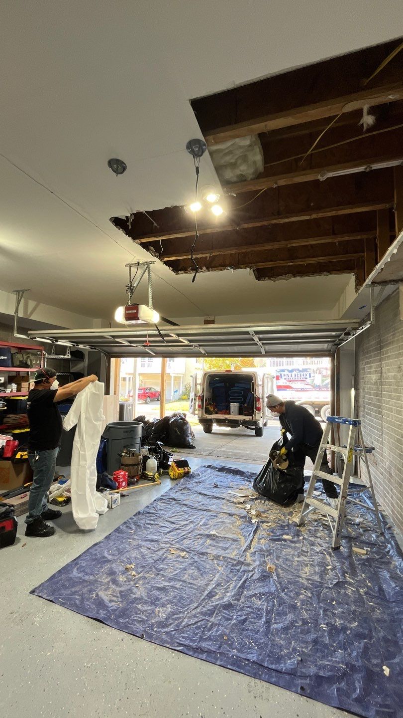 Standing water extraction underway in Ashburn water damage restoration, removing pooled water from flooded interior space.