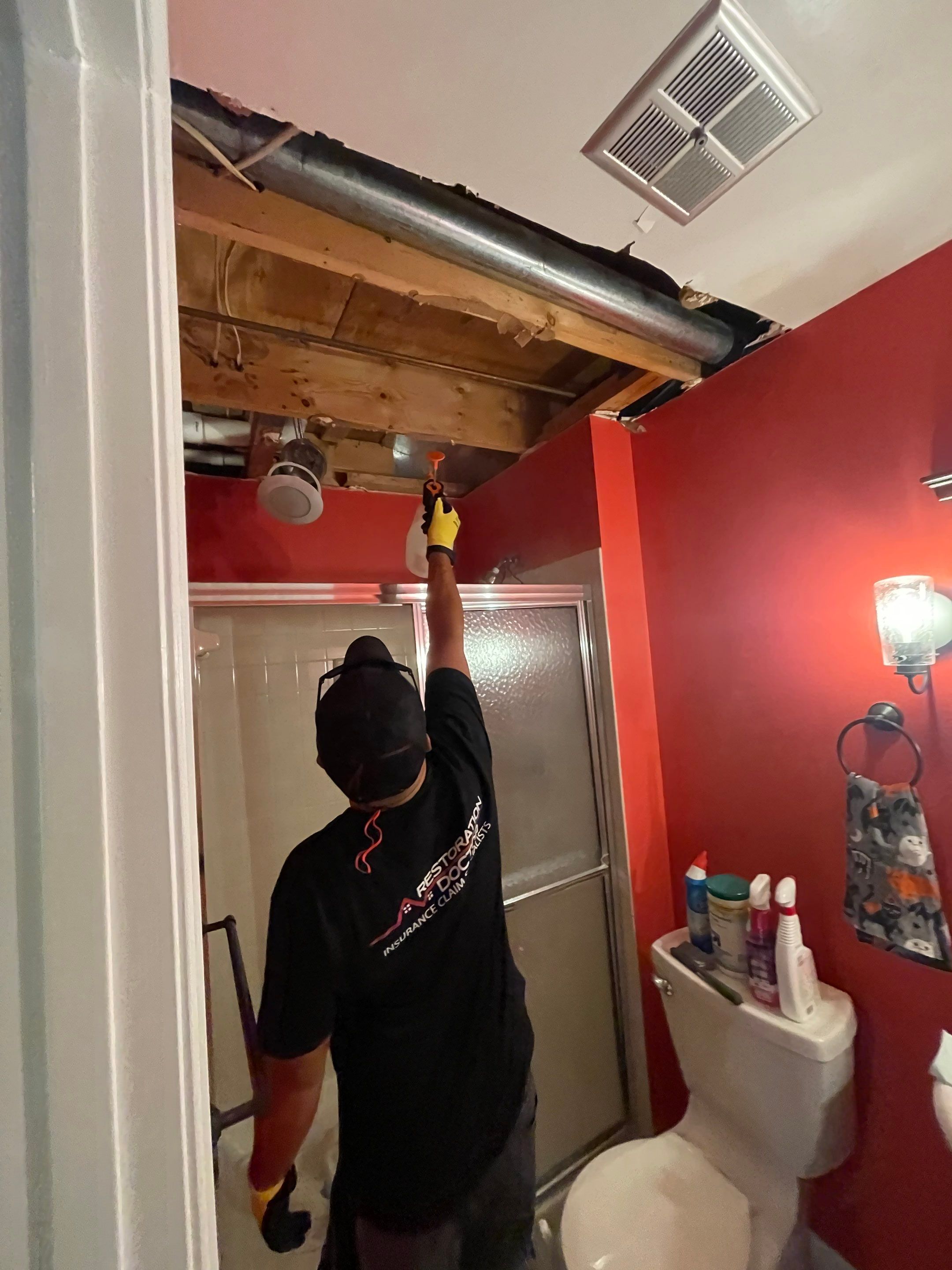 Thermal imaging camera documenting moisture distribution during water damage restoration in Centreville.