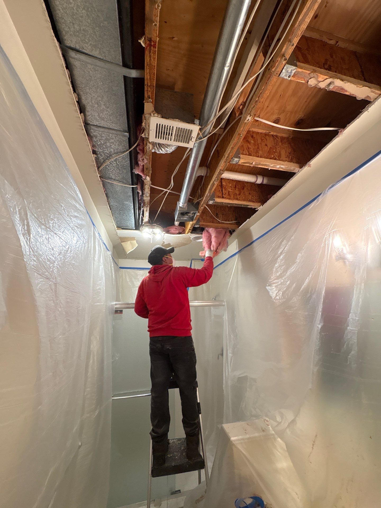 Dehumidifiers and air movers running during active drying phase of McLean water damage restoration.