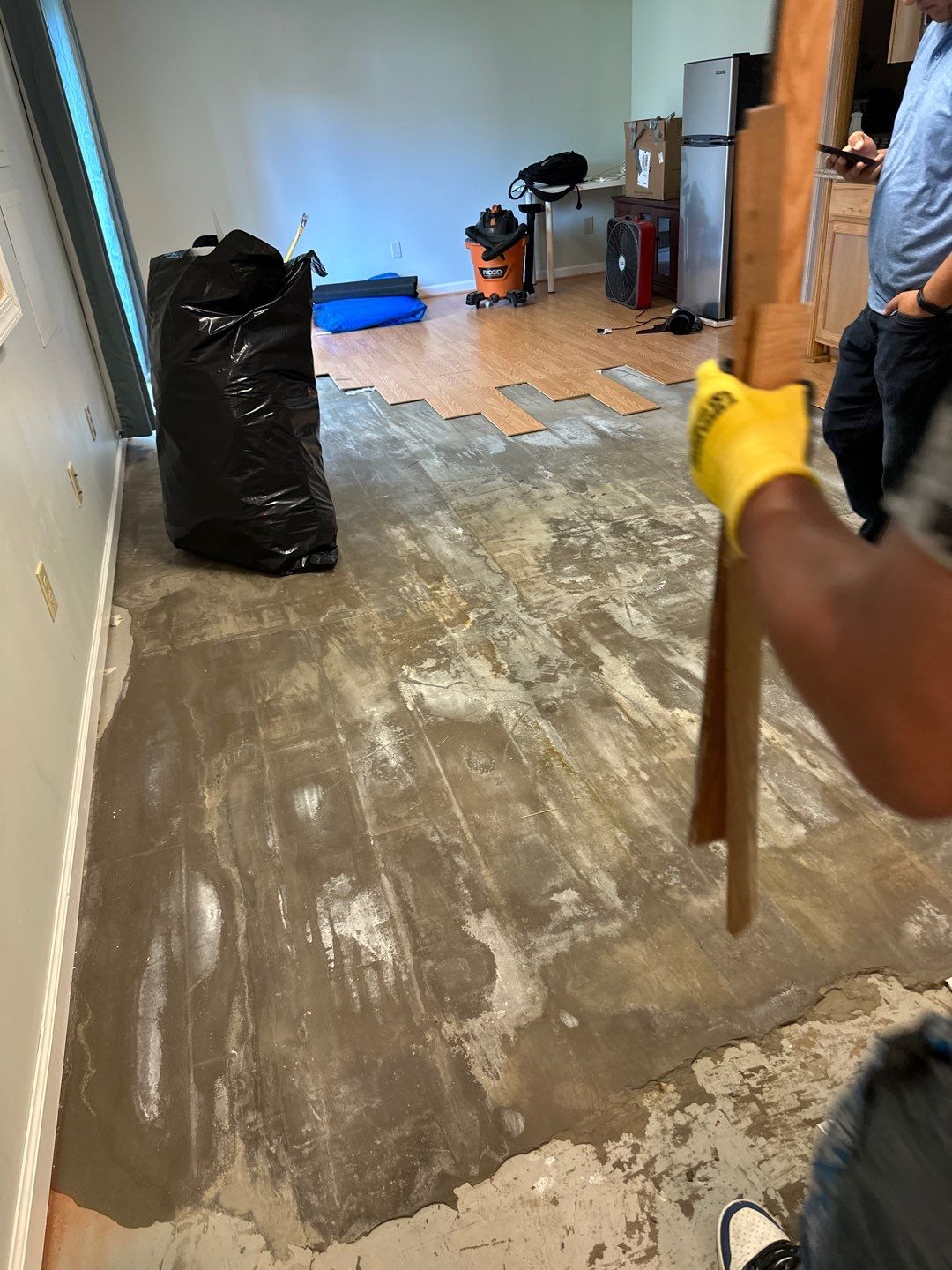 Advanced drying phase with equipment positioned for final moisture removal from flooring and framing.