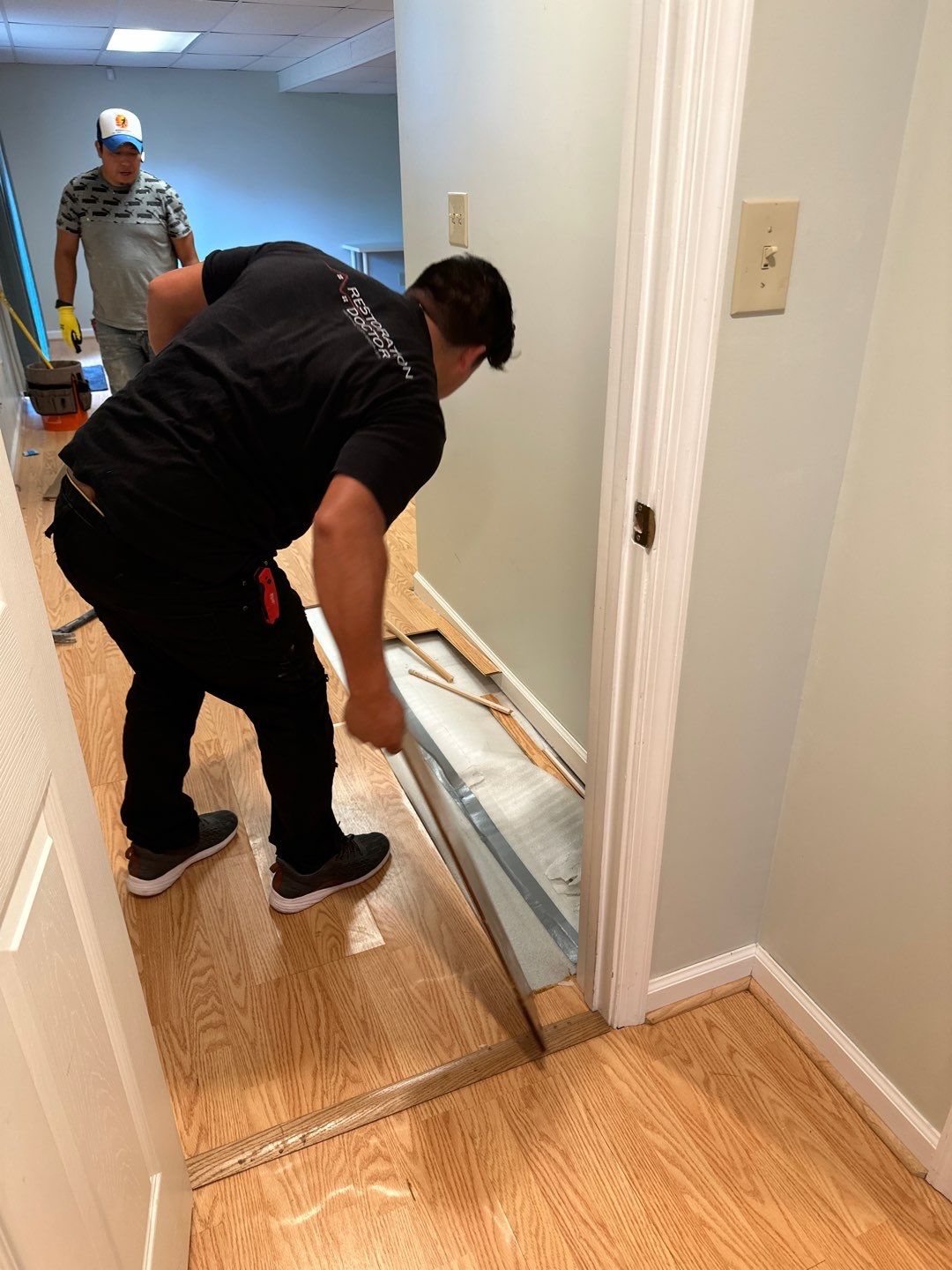 Completed water damage restoration in Sterling showing dried flooring and cleared restoration equipment.