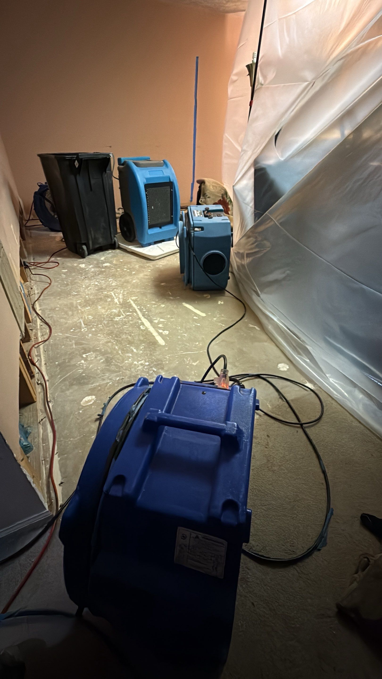 Baseboard replacement in progress following water damage restoration work in Burke.