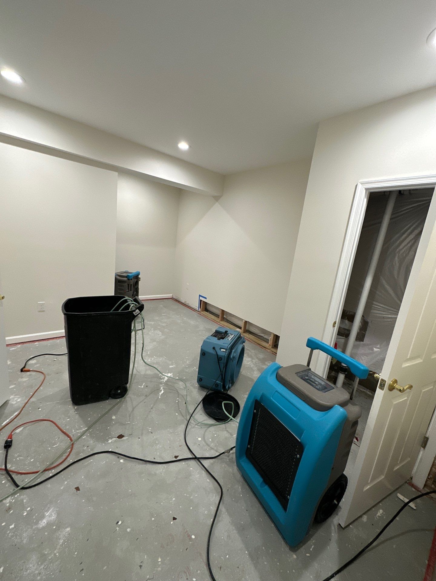 Replaced baseboard and dried wall assembly following completion of water damage restoration in McLean.