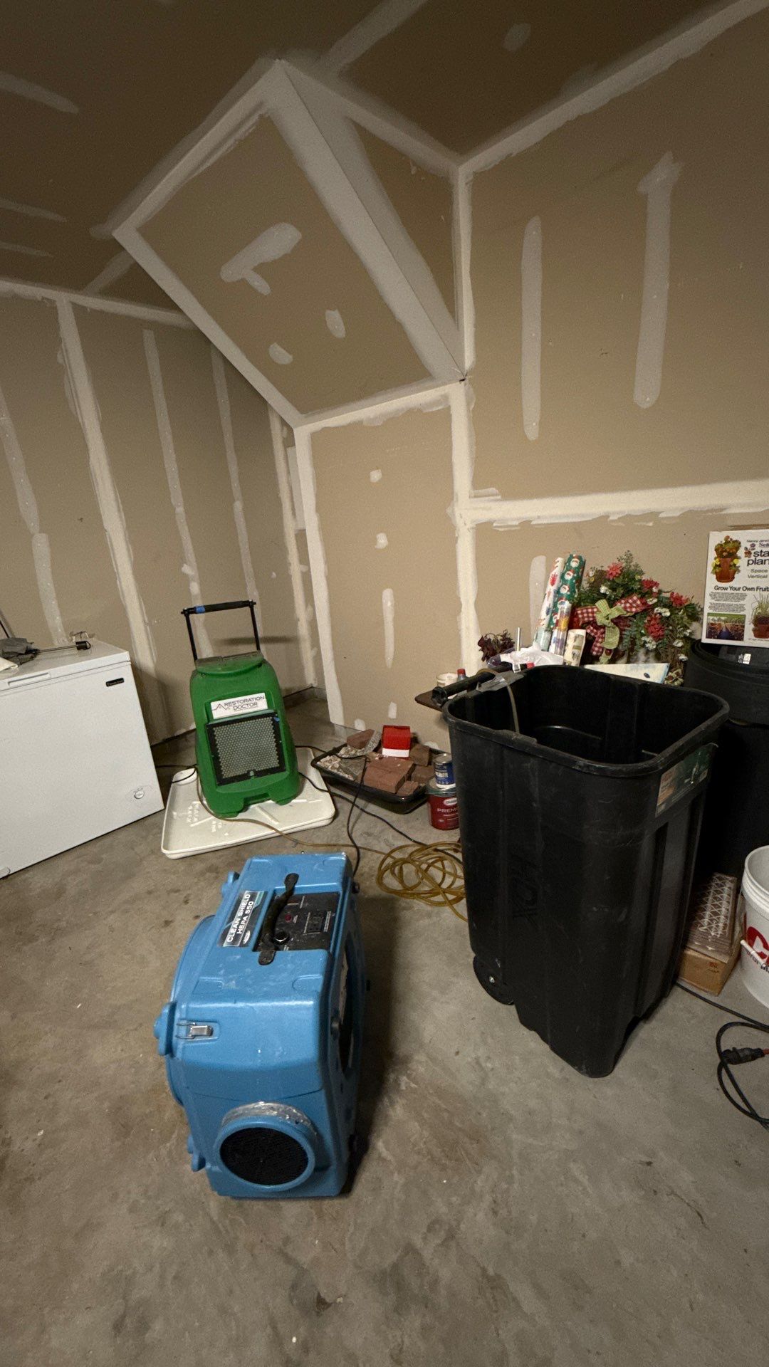Dehumidification and air movement equipment operating inside sealed containment barrier.