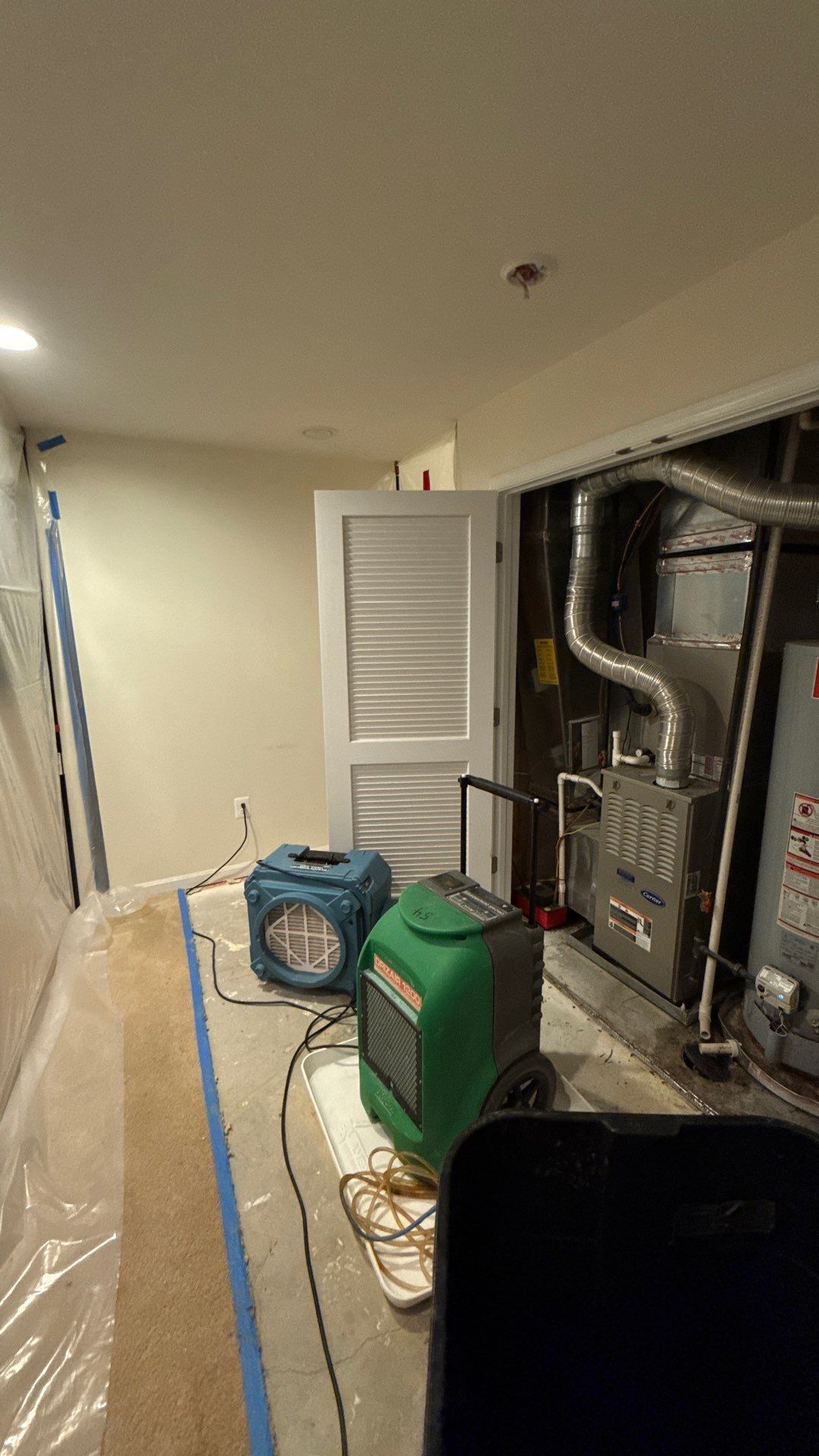 Containment barrier removal after water damage restoration and structural drying completed.