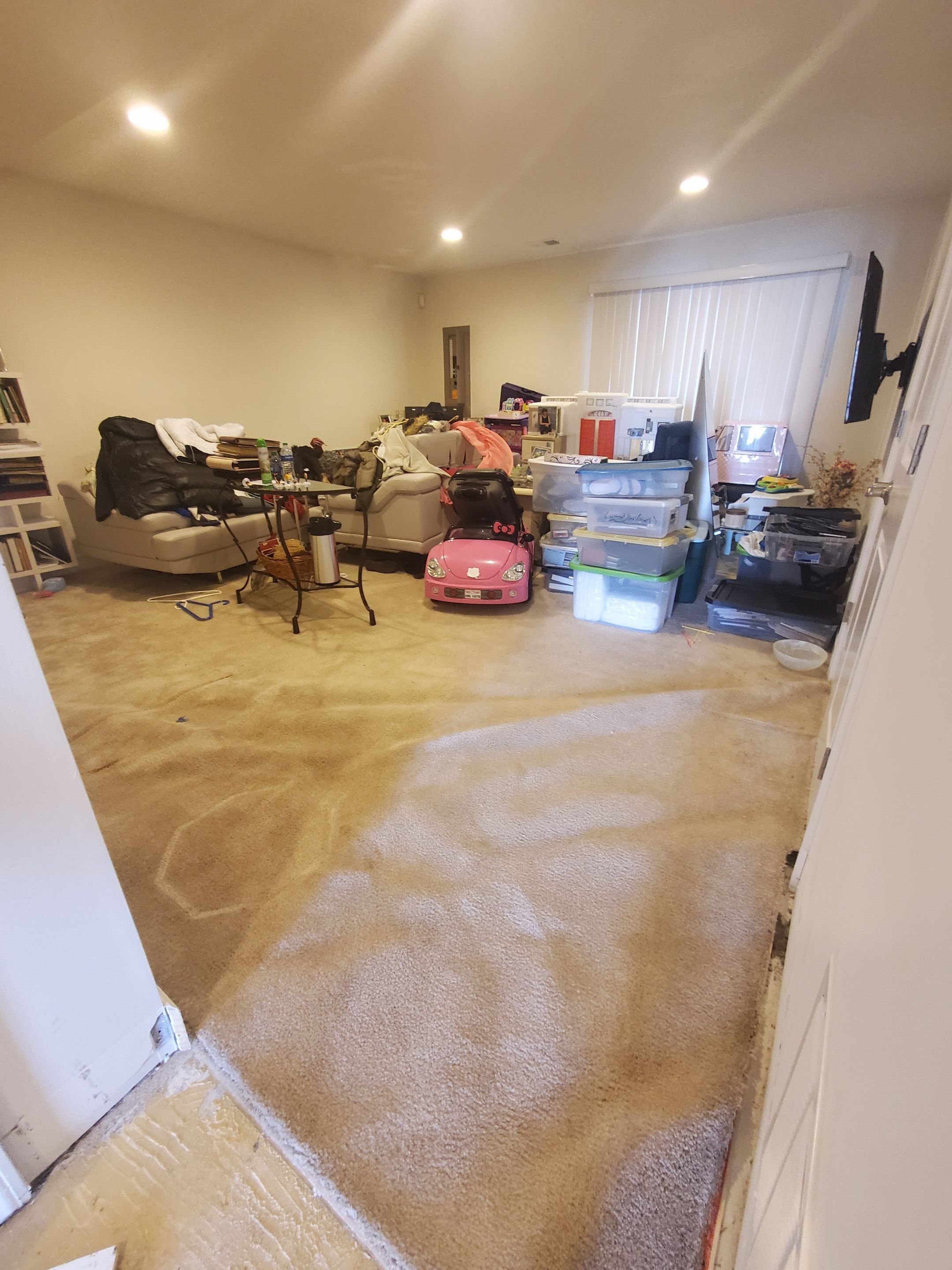 Continued dehumidification process with equipment monitoring moisture levels in flooring and structural materials.