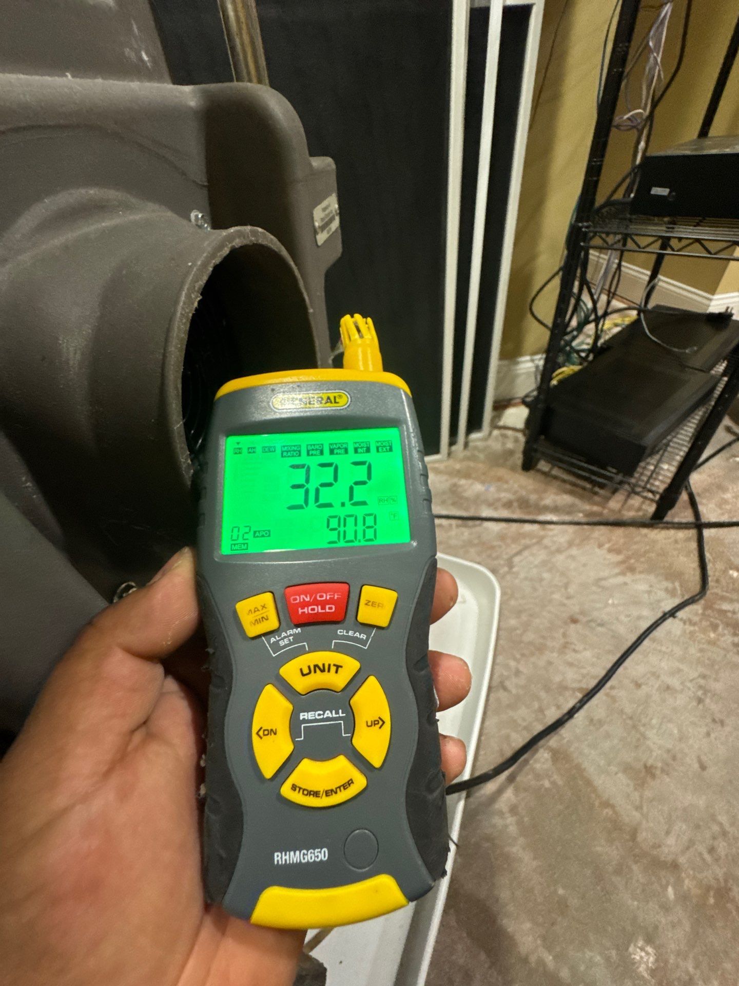 Mid-stage drying operation showing dehumidifiers and air movers managing moisture extraction.