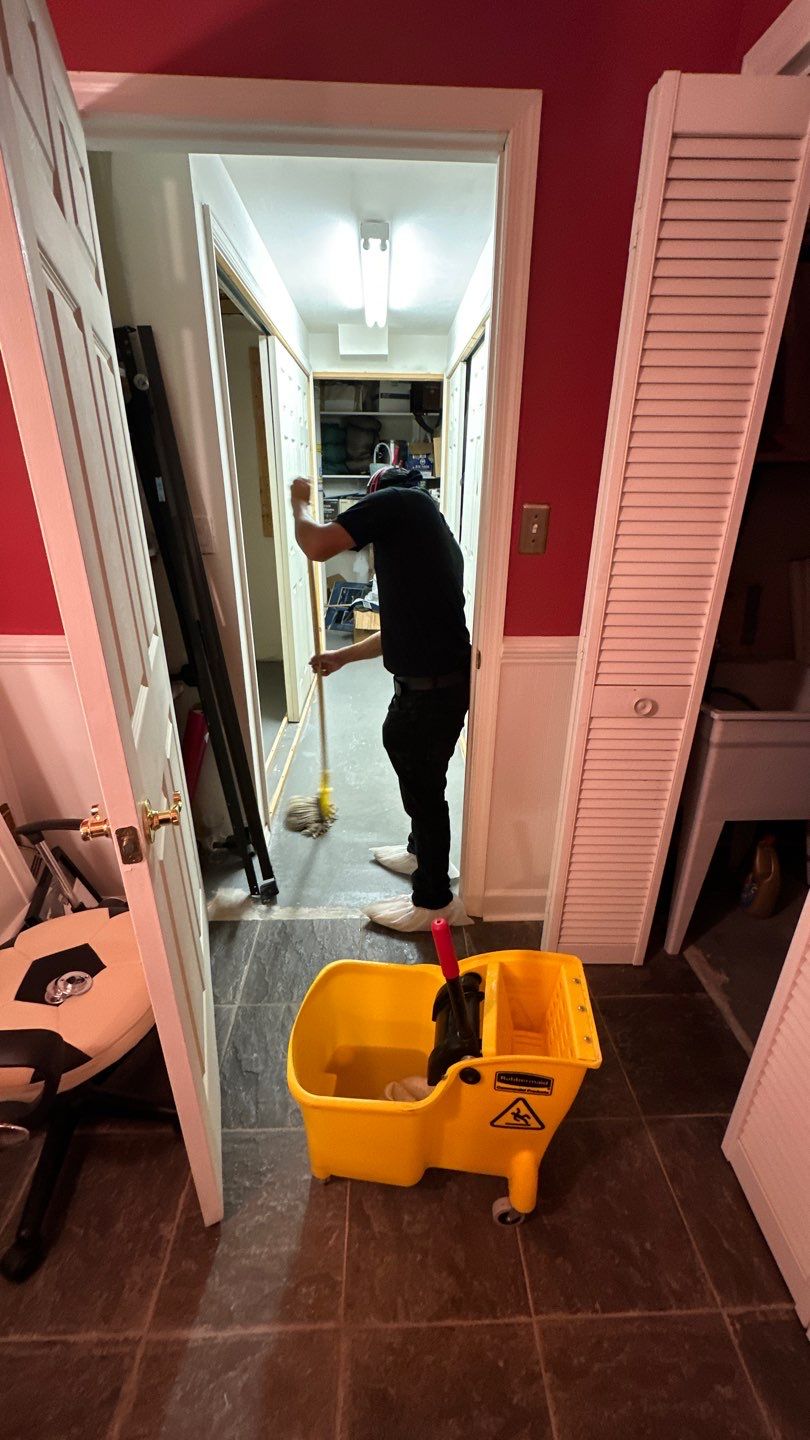 Mid-stage drying process showing continued dehumidification and moisture extraction during water restoration.