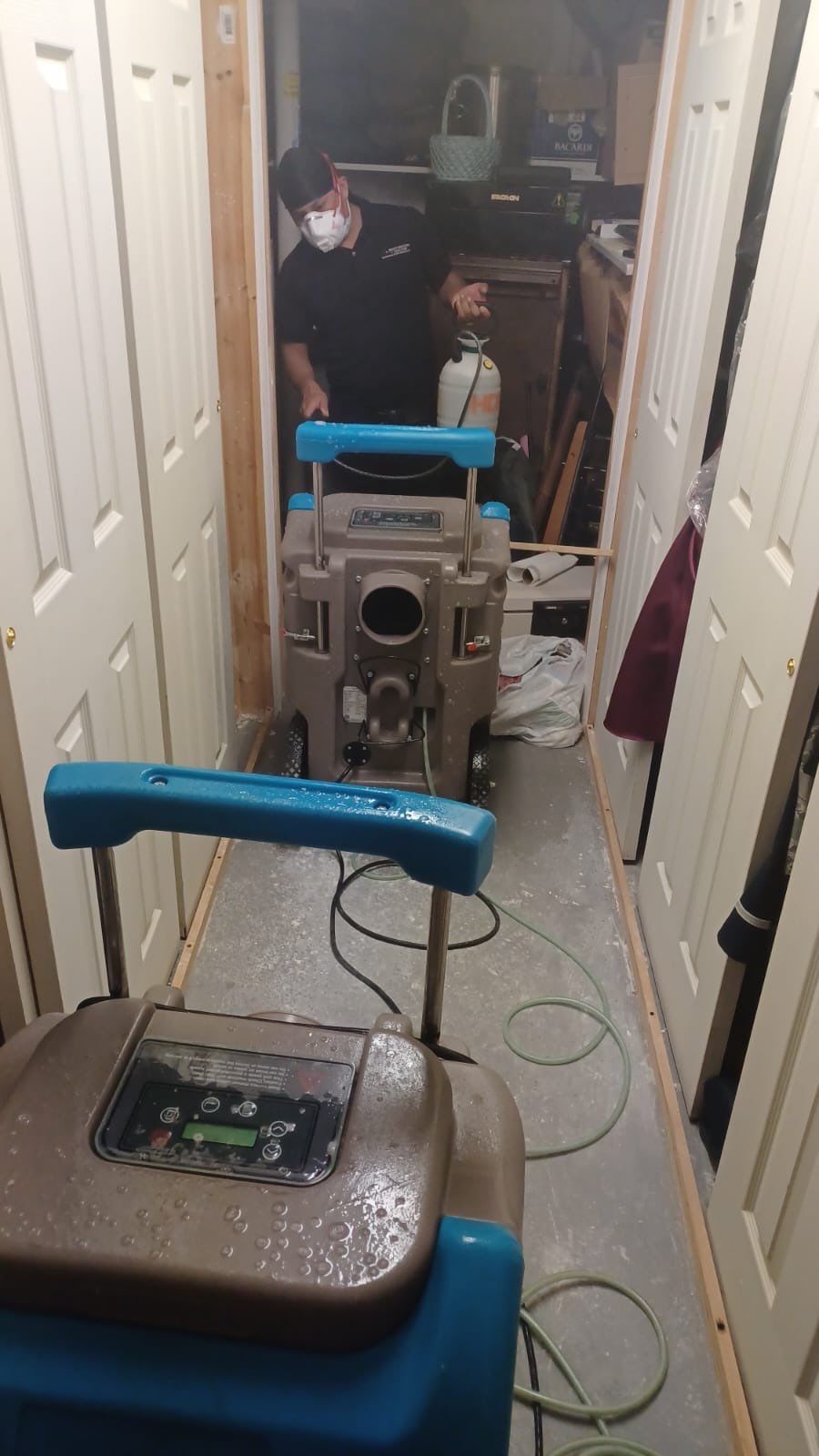 Water damage restoration underway in Fairfax Station with dehumidification and structural drying equipment deployed.