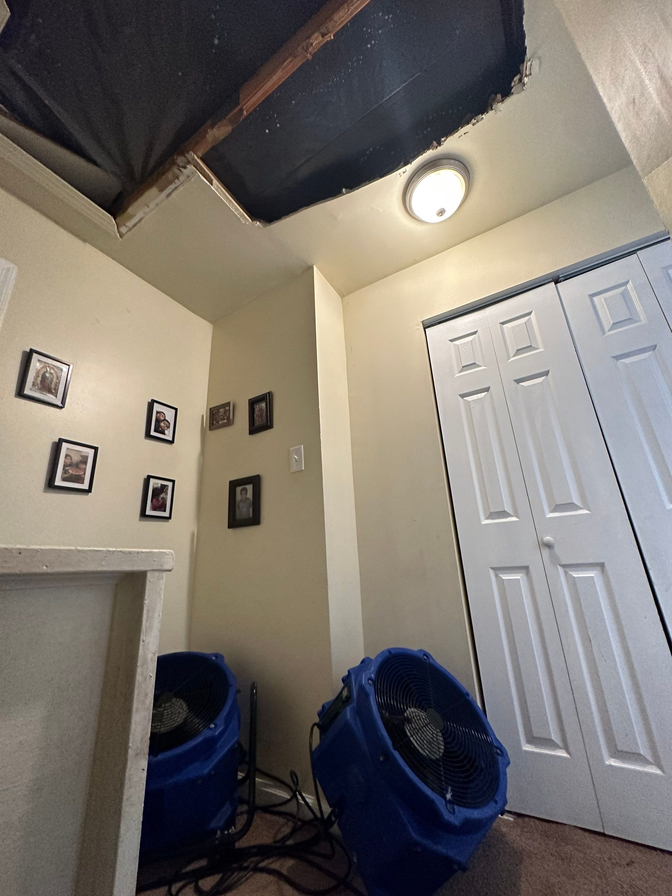 Repaired ceiling after water damage restoration, structural drying complete in Fredericksburg home.