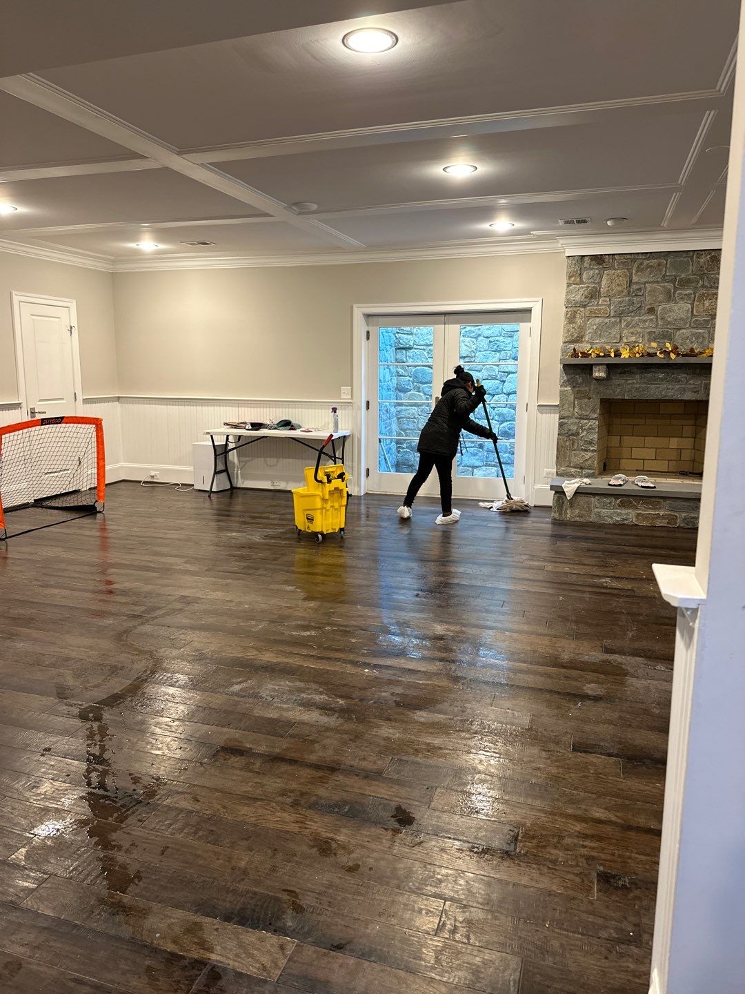 Flooring assessment and preparation phase of water damage restoration work in residential space.