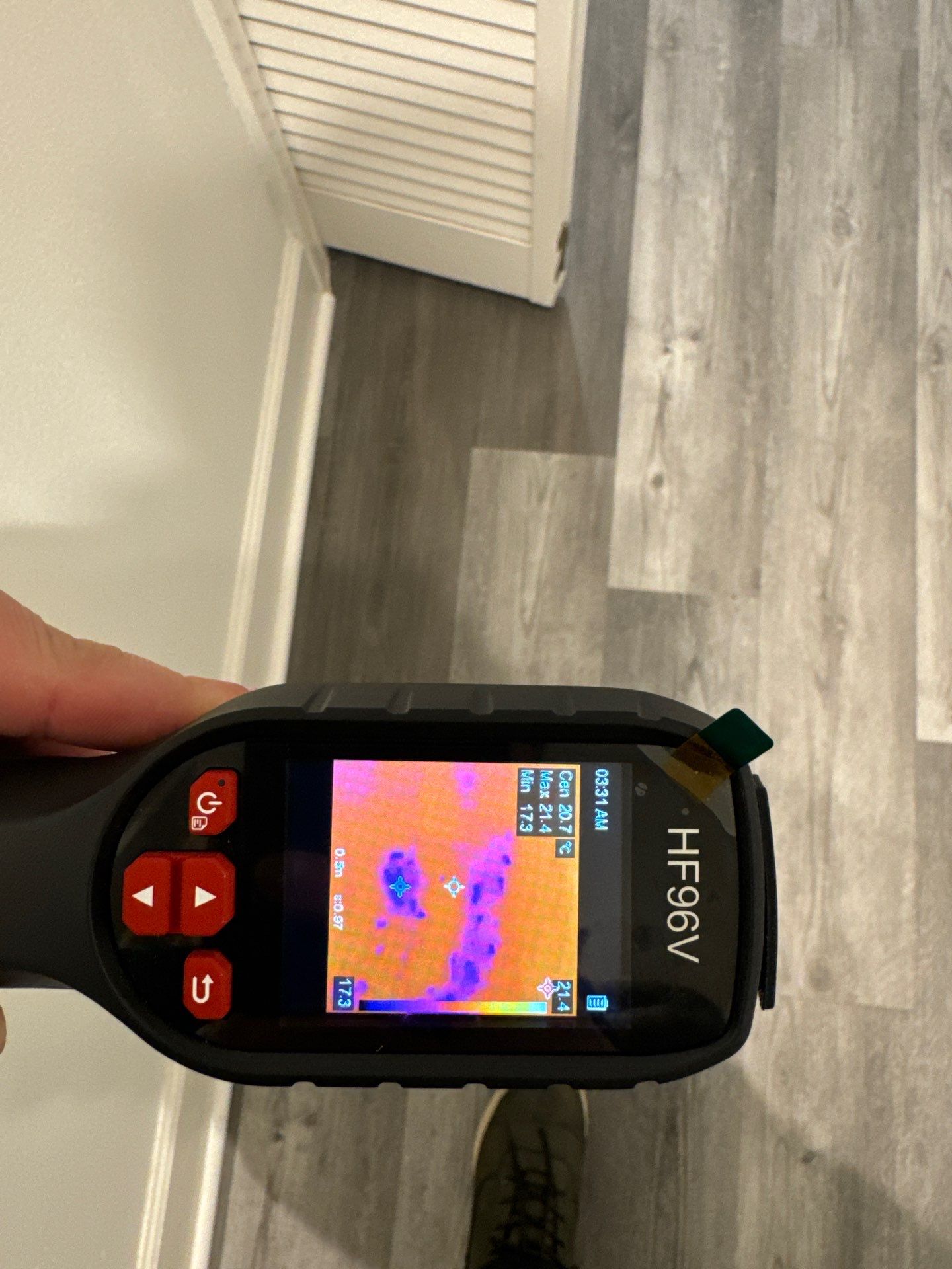 Thermal imaging camera documenting moisture patterns during mold remediation inspection in Sterling.