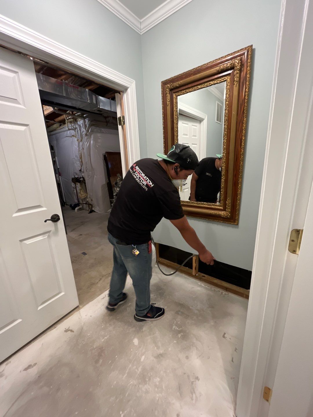 Basement with standing sewage water and saturated materials after backup in Ashburn.