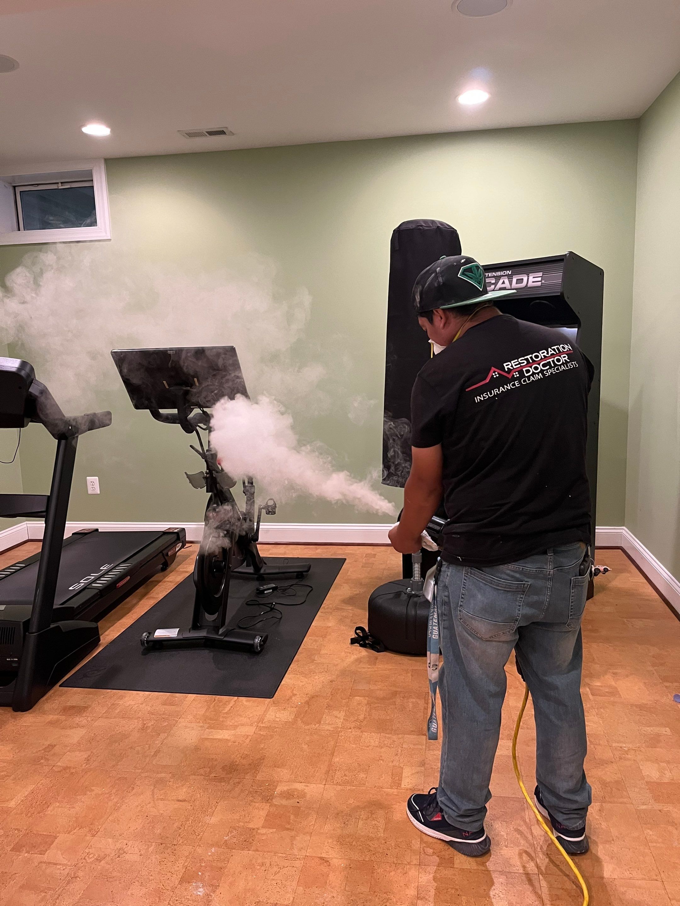 Dehumidifiers and air movers running to dry basement after sewage backup removal.