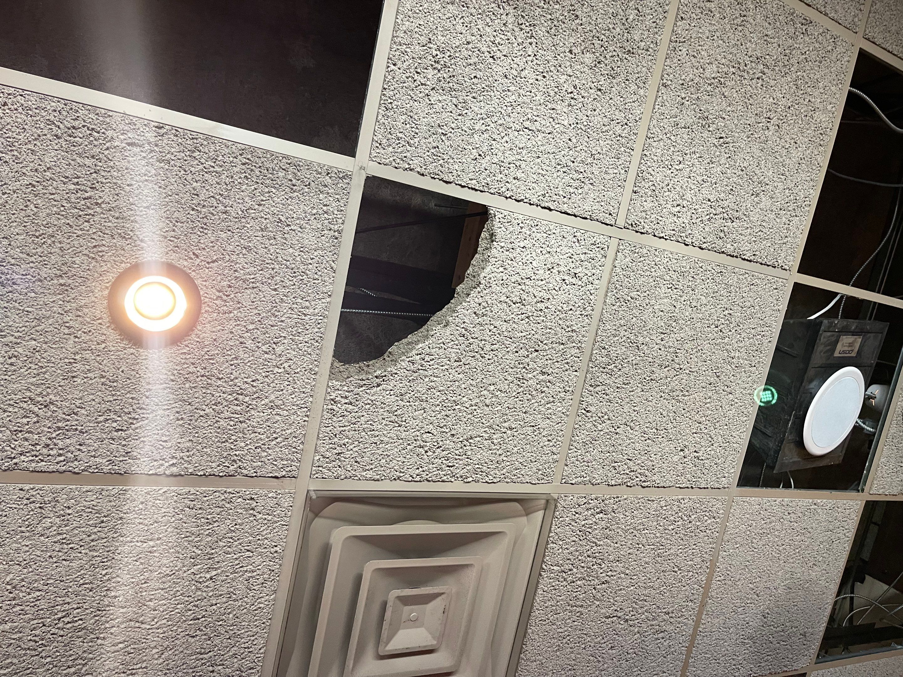 Ceiling cavity exposed for inspection and drying as part of water damage mitigation work.