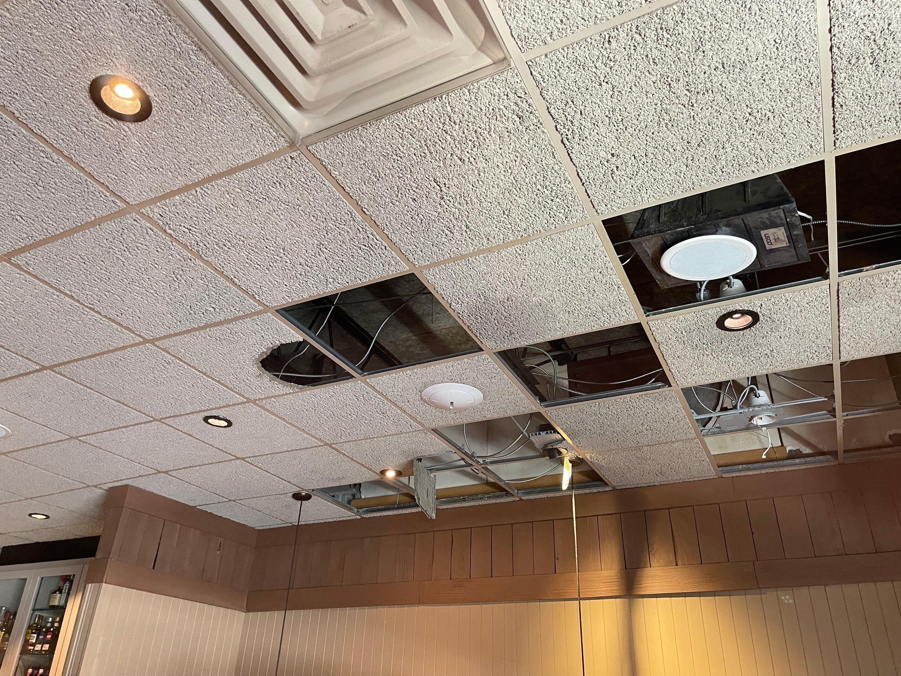 Structural framing and substrate drying in progress during water damage restoration sequence.
