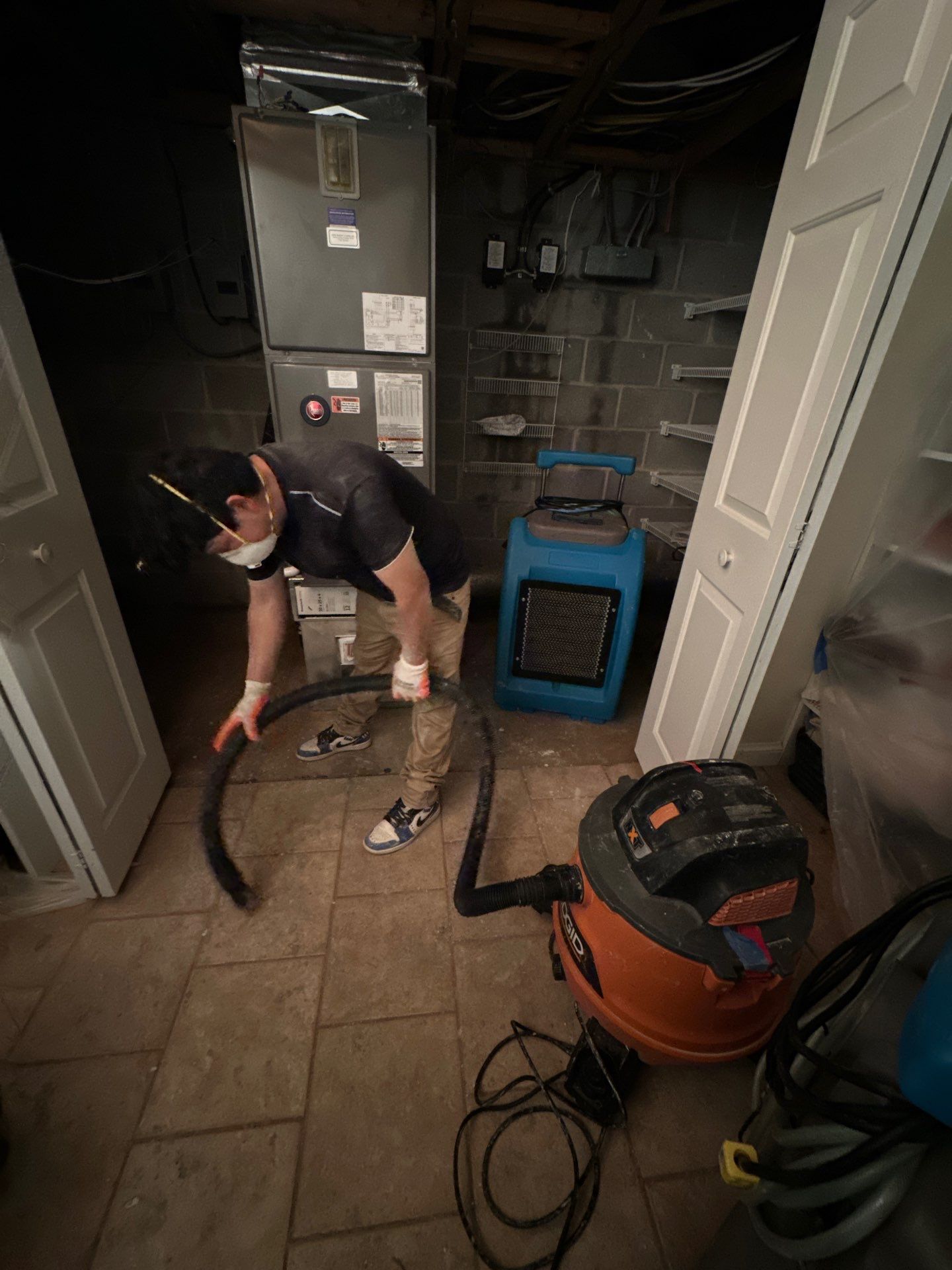 Structural drying in progress with moisture management equipment deployed throughout affected space.