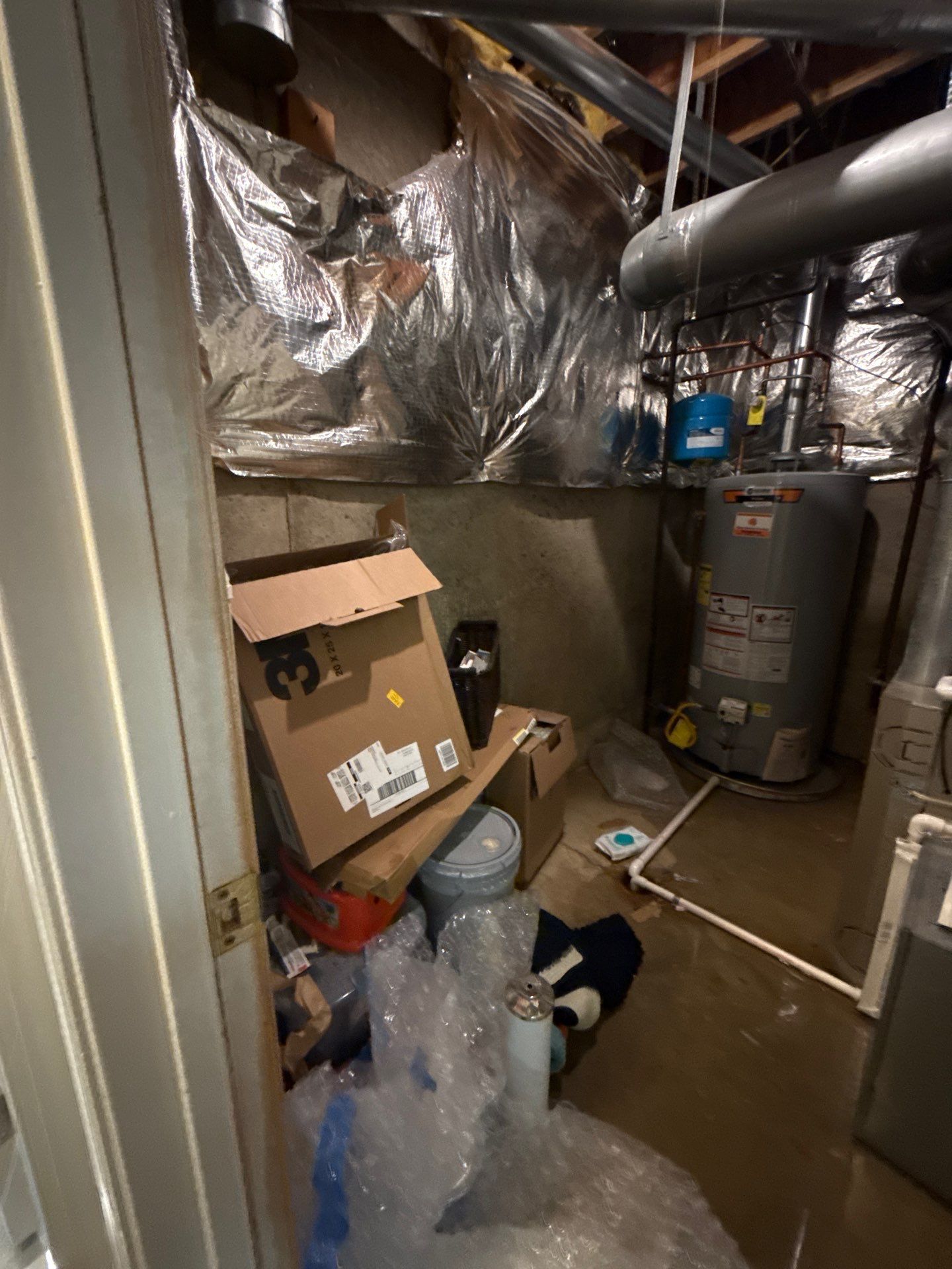 Moisture removal and air circulation continuing through mid-stage water damage restoration work.