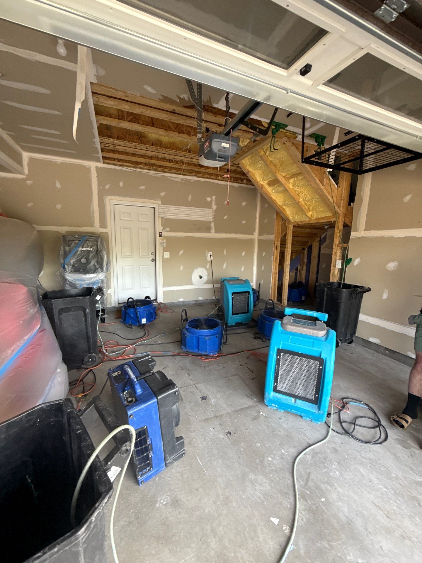Water-damaged drywall and ceiling framing exposed during initial assessment of Sterling restoration job.